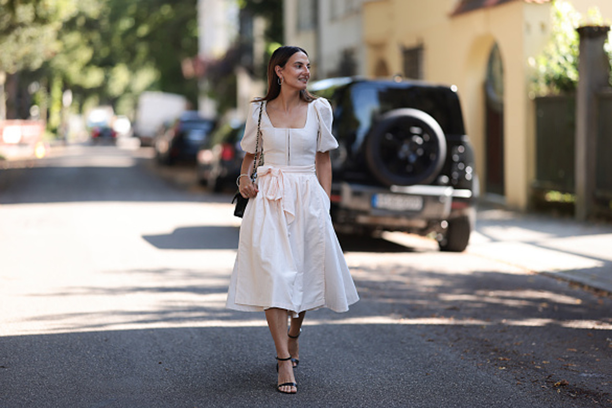women wearing white puff sleeve dress