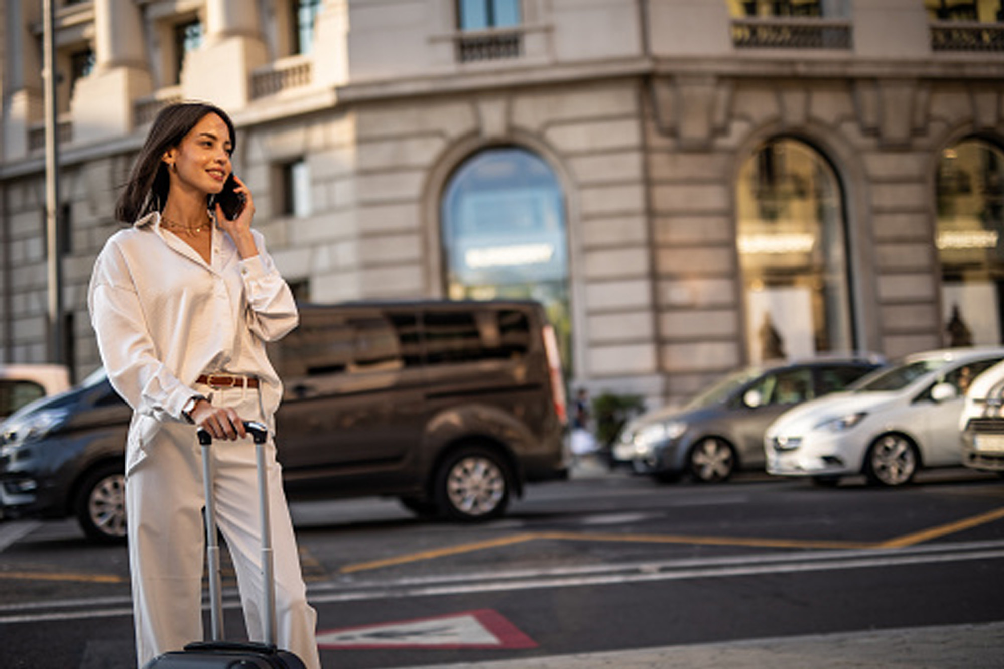 woman wearing white blouse and pants in city