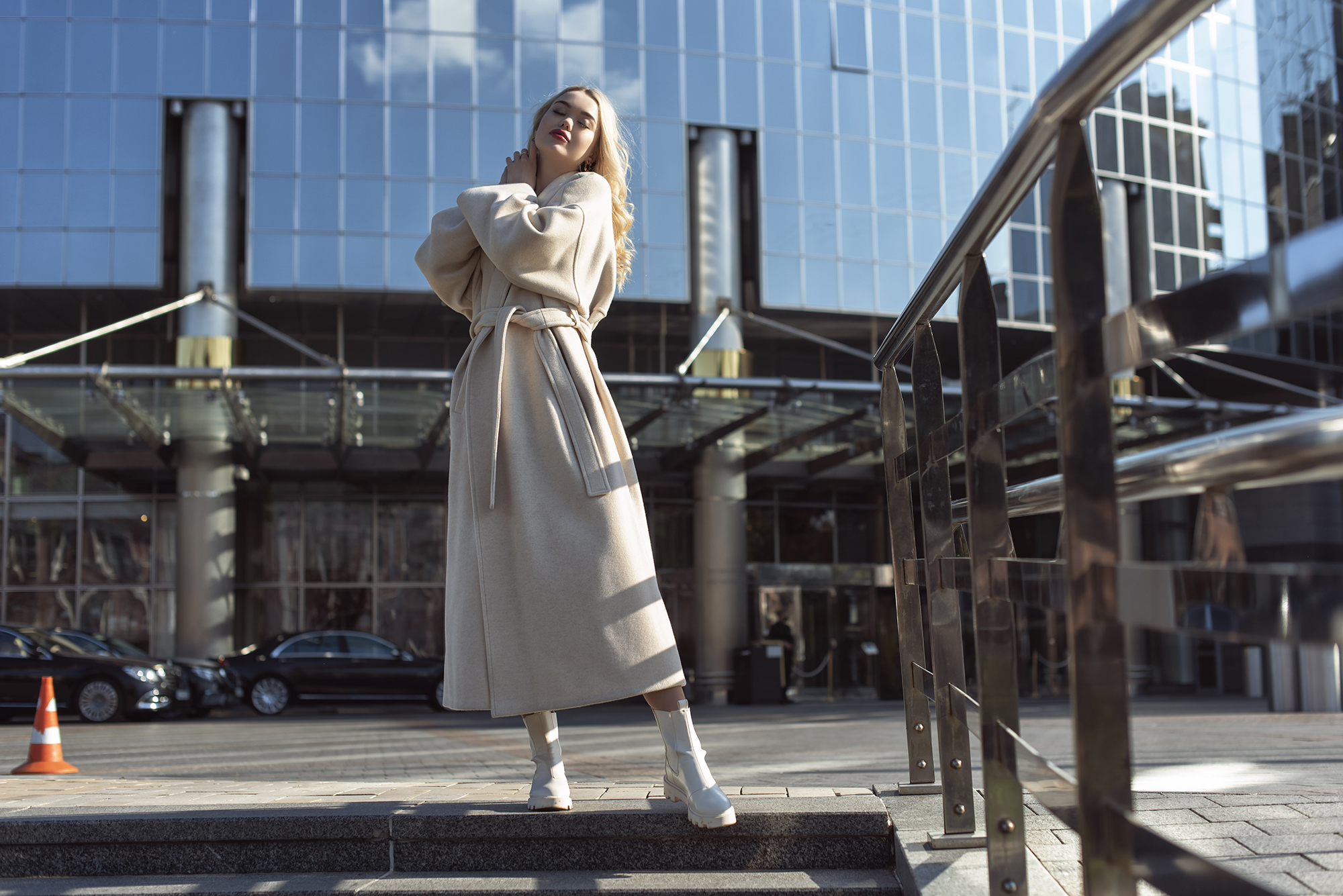 Young blonde woman in autumn city