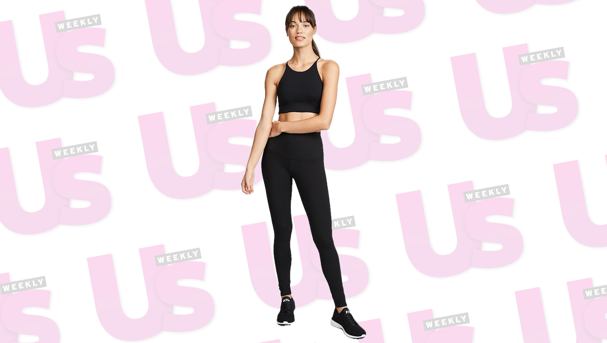 a woman in black leggings in front of a patterned background.