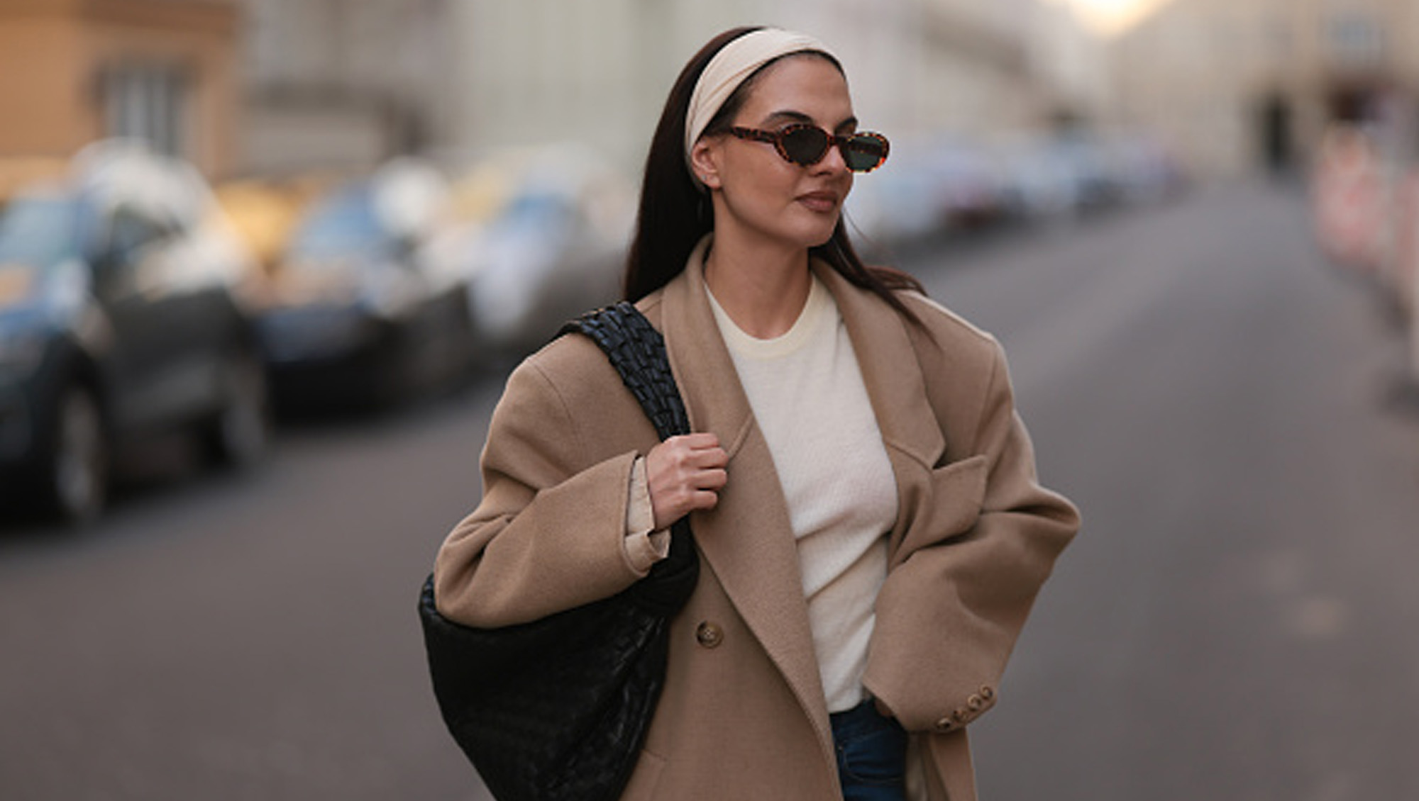 woman wearing headband and beige blazer