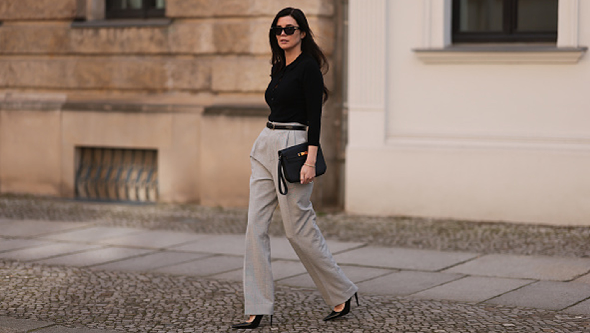 woman wearing beige pants and black top