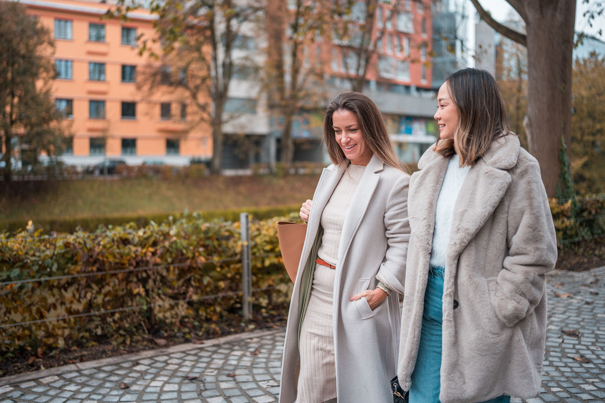 Mid Adult Companions Exchanging Stories on Autumn Day