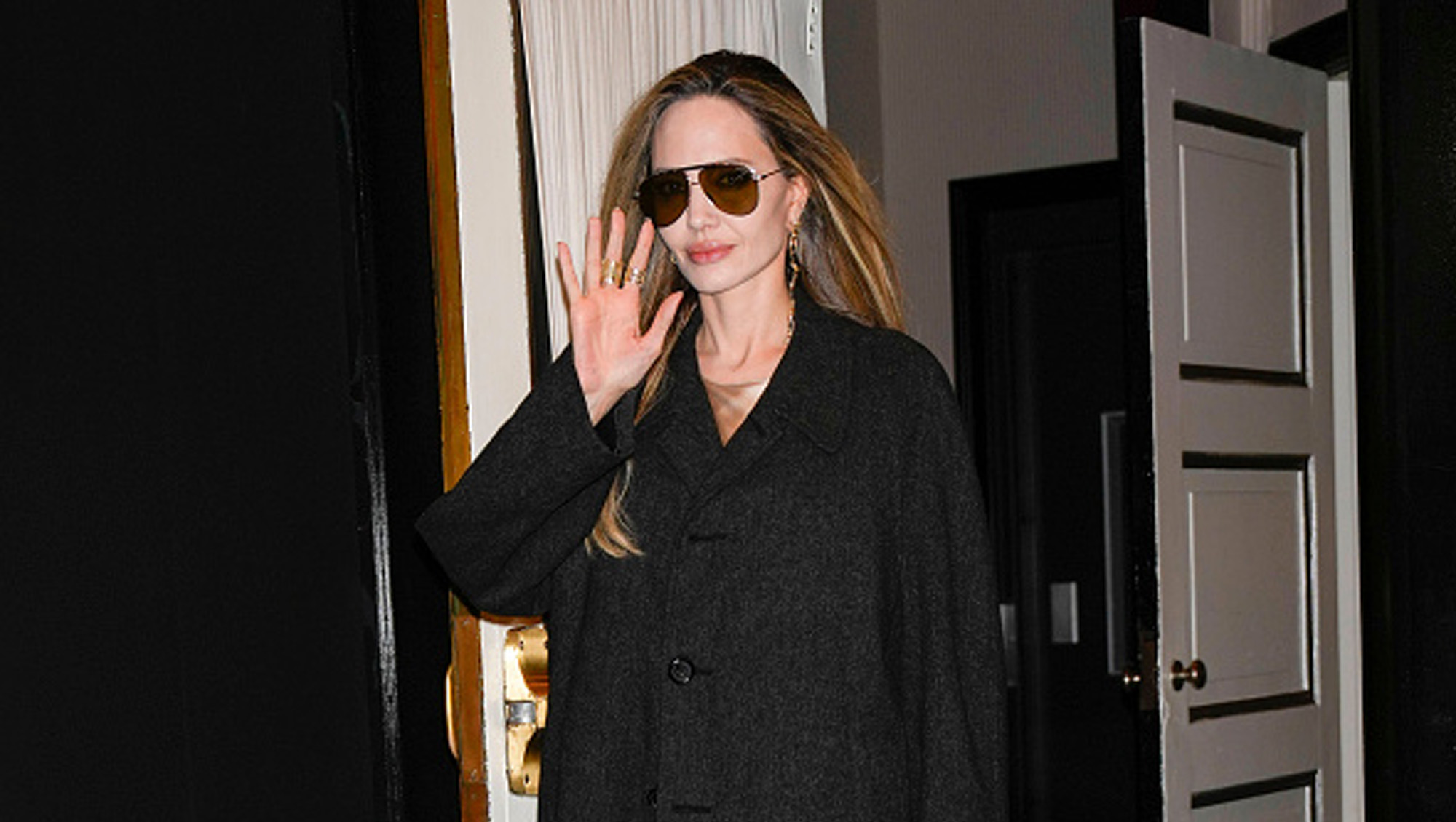 angelina jolie in black trench coat