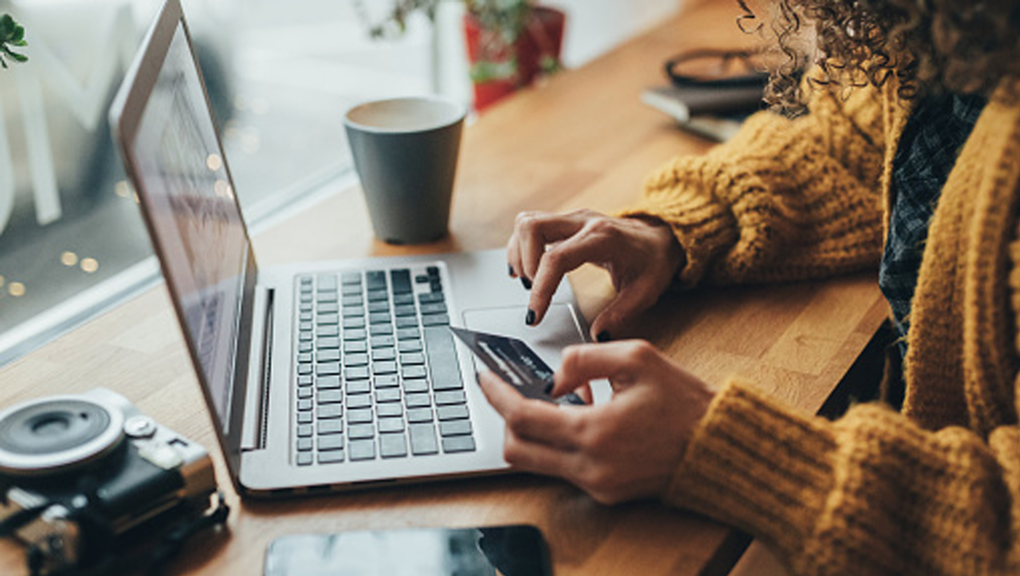 woman with laptop and credit card