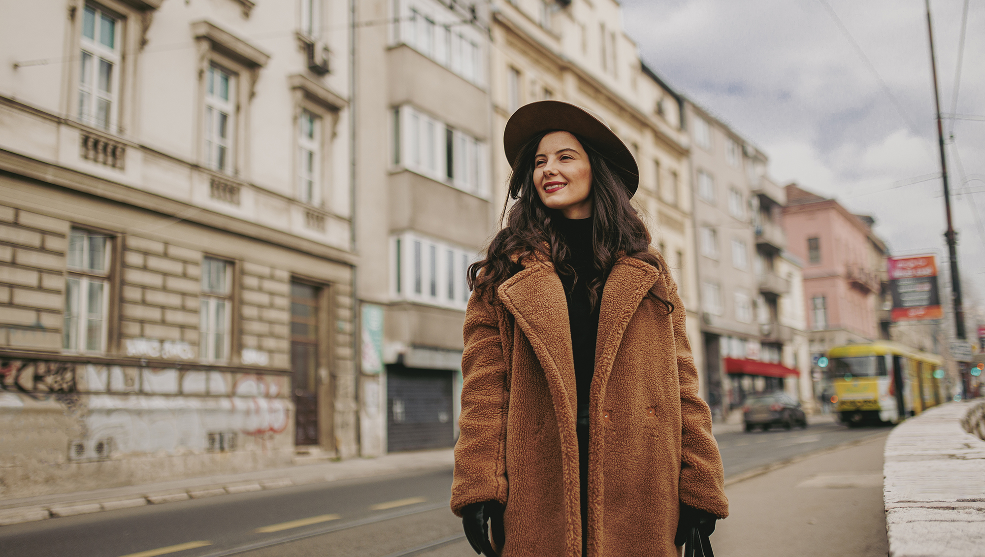 A smiling young woman at the downtown district