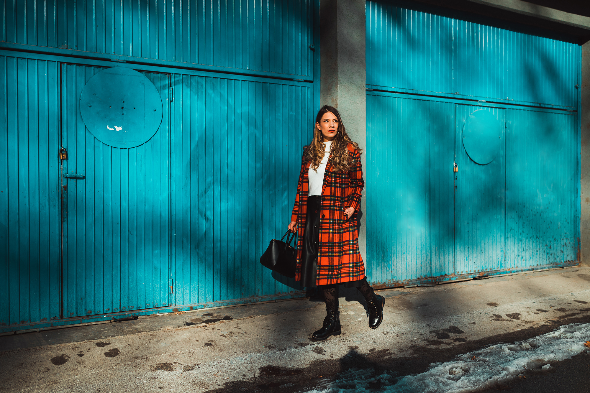 Fashionable woman enjoying a lovely winter day in the city