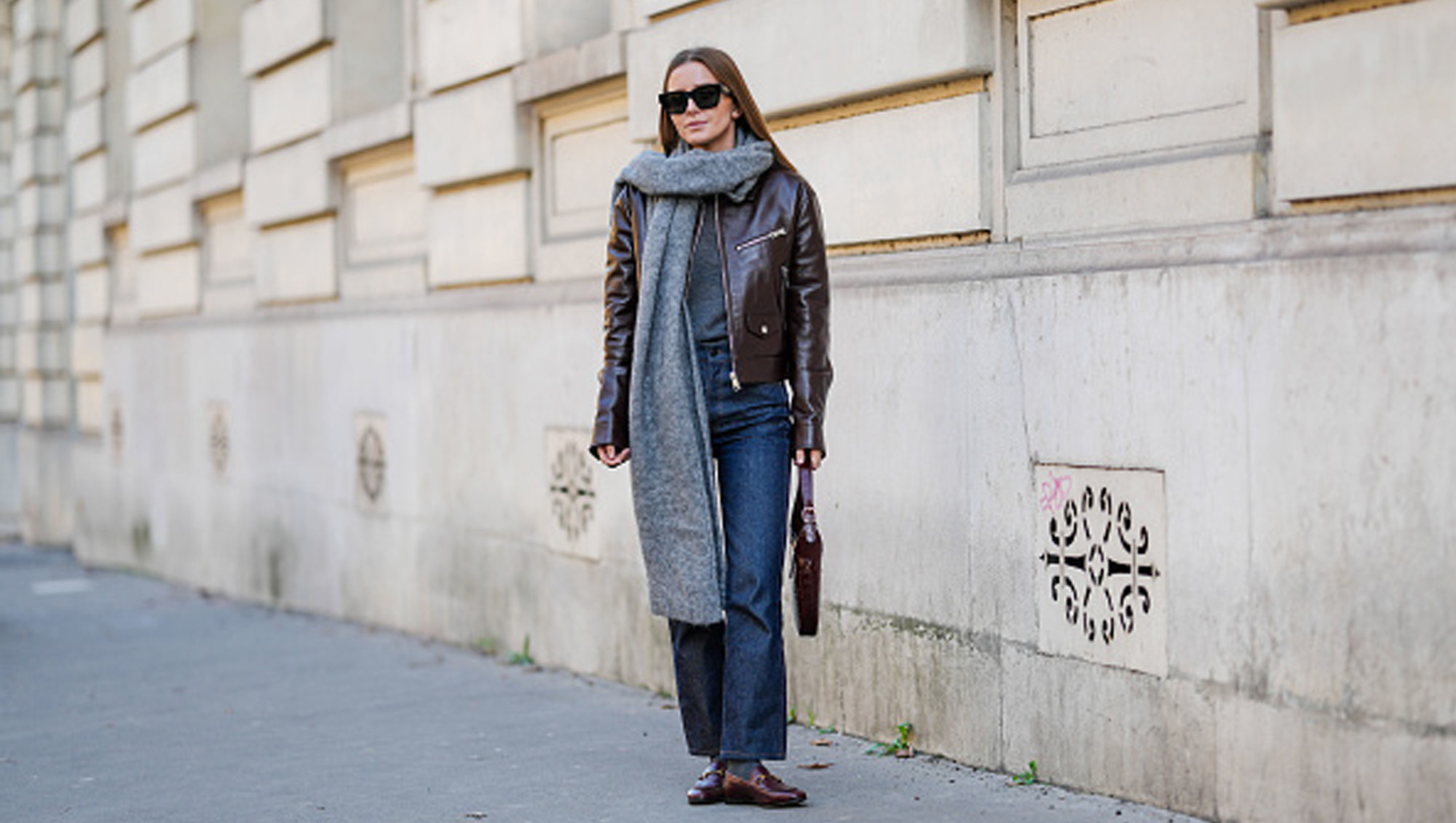 woman wearing jacket, jeans and scarf