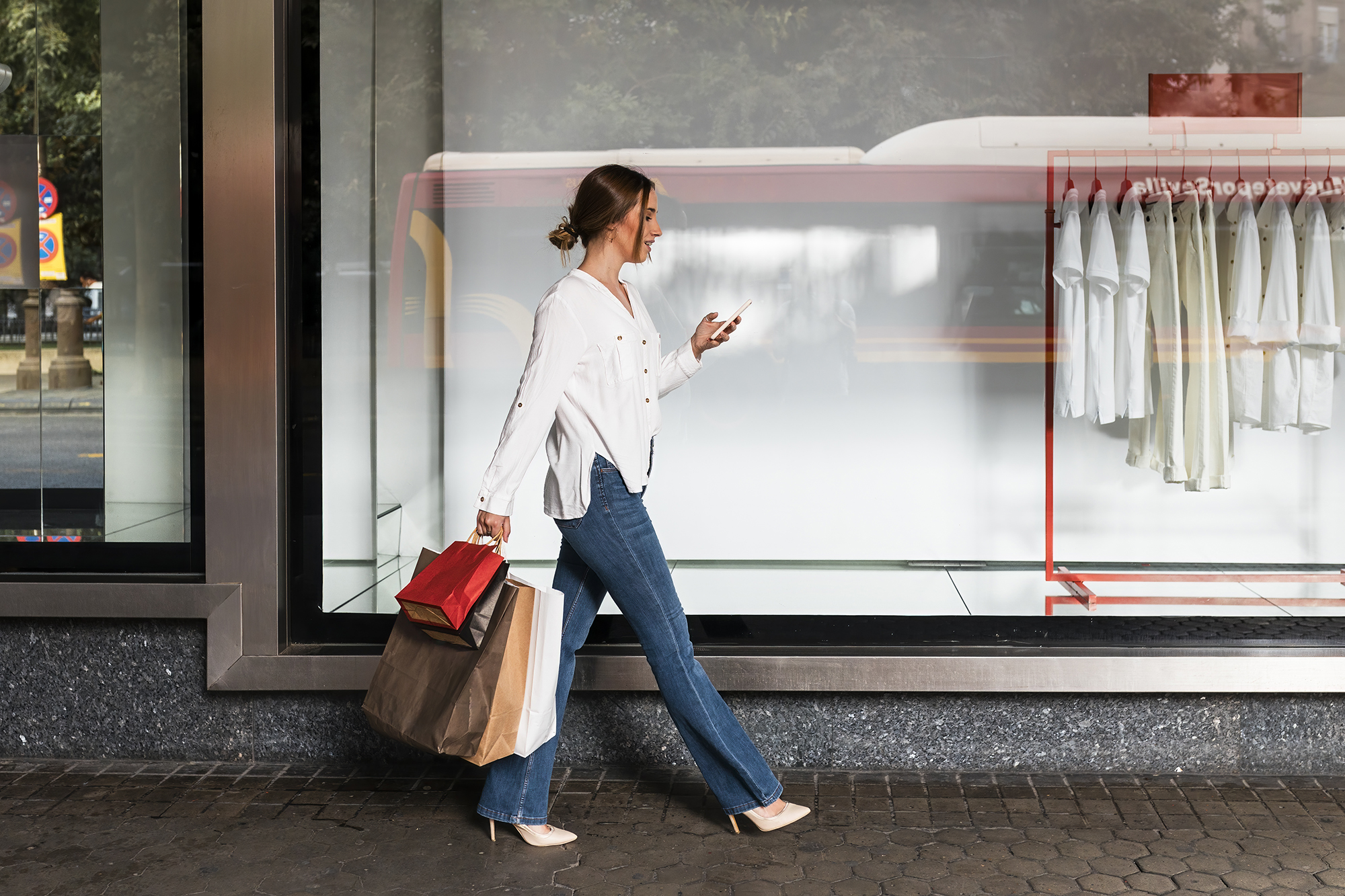 Young woman shopping in streets, Seville, Spain