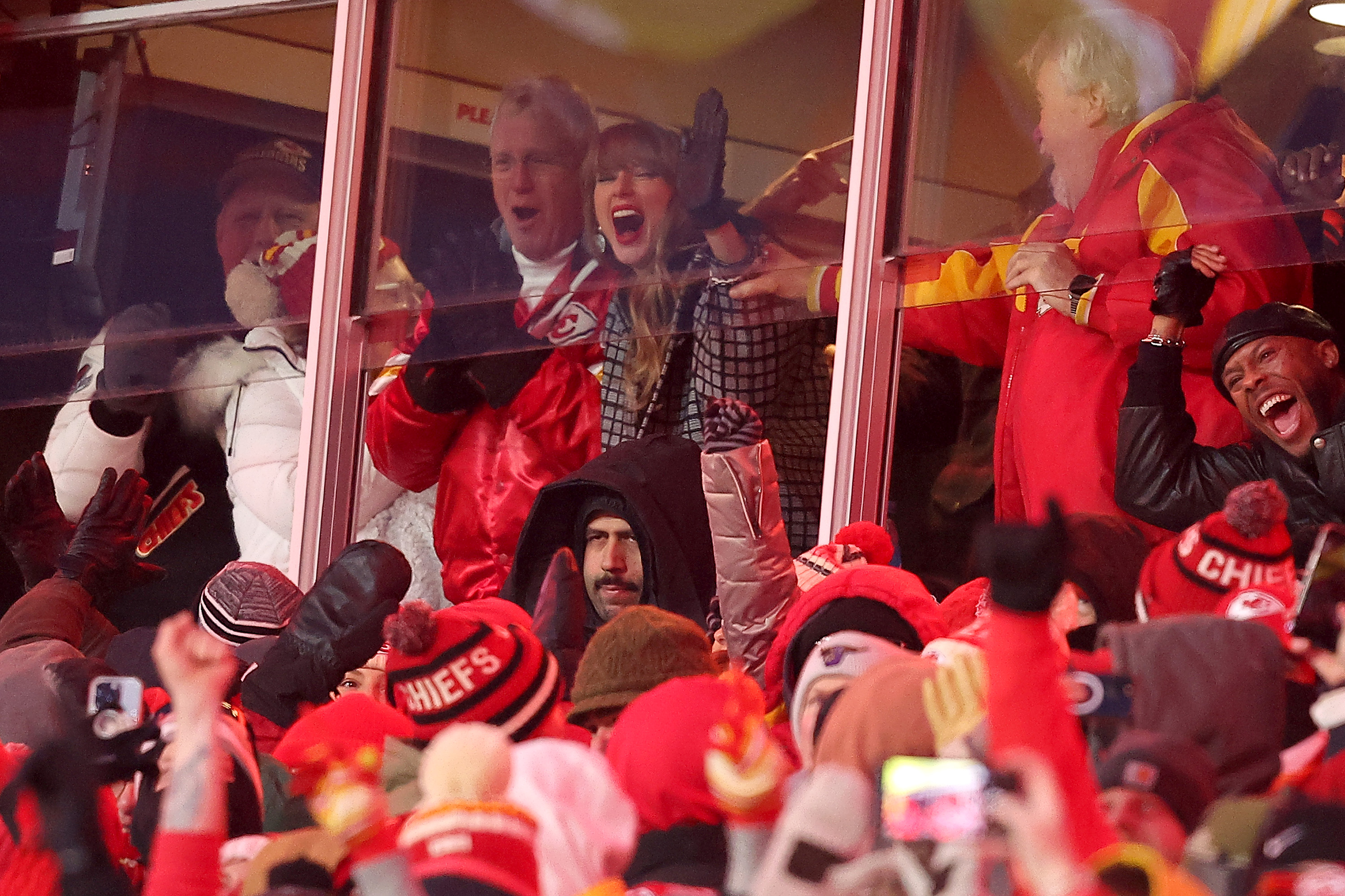 KANSAS CITY, MISSOURI - JANUARY 18: Singer-songwriter Taylor Swift celebrates Travis Kelce #87 of the Kansas City Chiefs touchdown against the Houston Texans during the fourth quarter in the AFC Divisional Playoff at GEHA Field at Arrowhead Stadium on January 18, 2025 in Kansas City, Missouri. (Photo by David Eulitt/Getty Images)