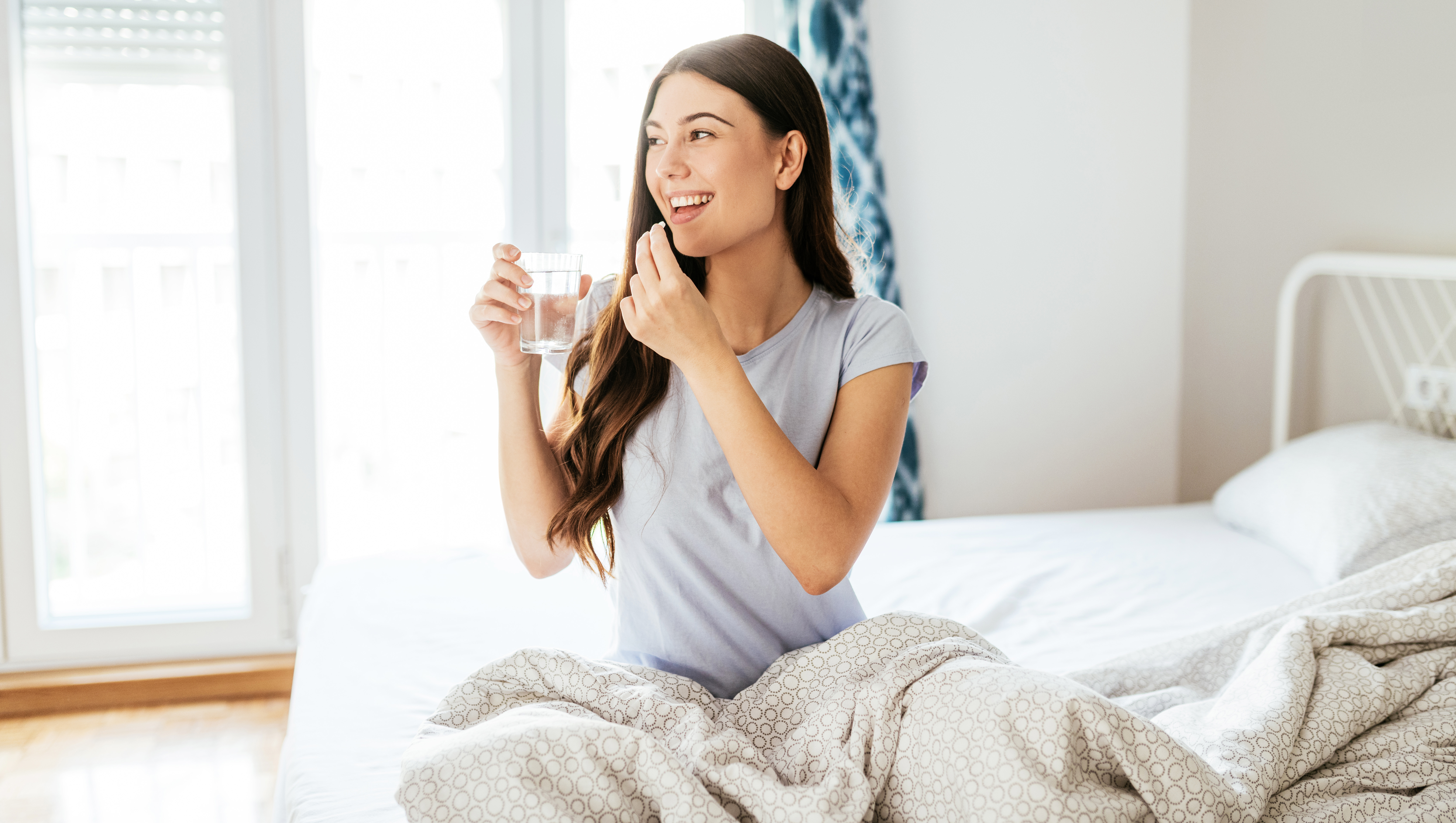 Healthy young woman taking supplements