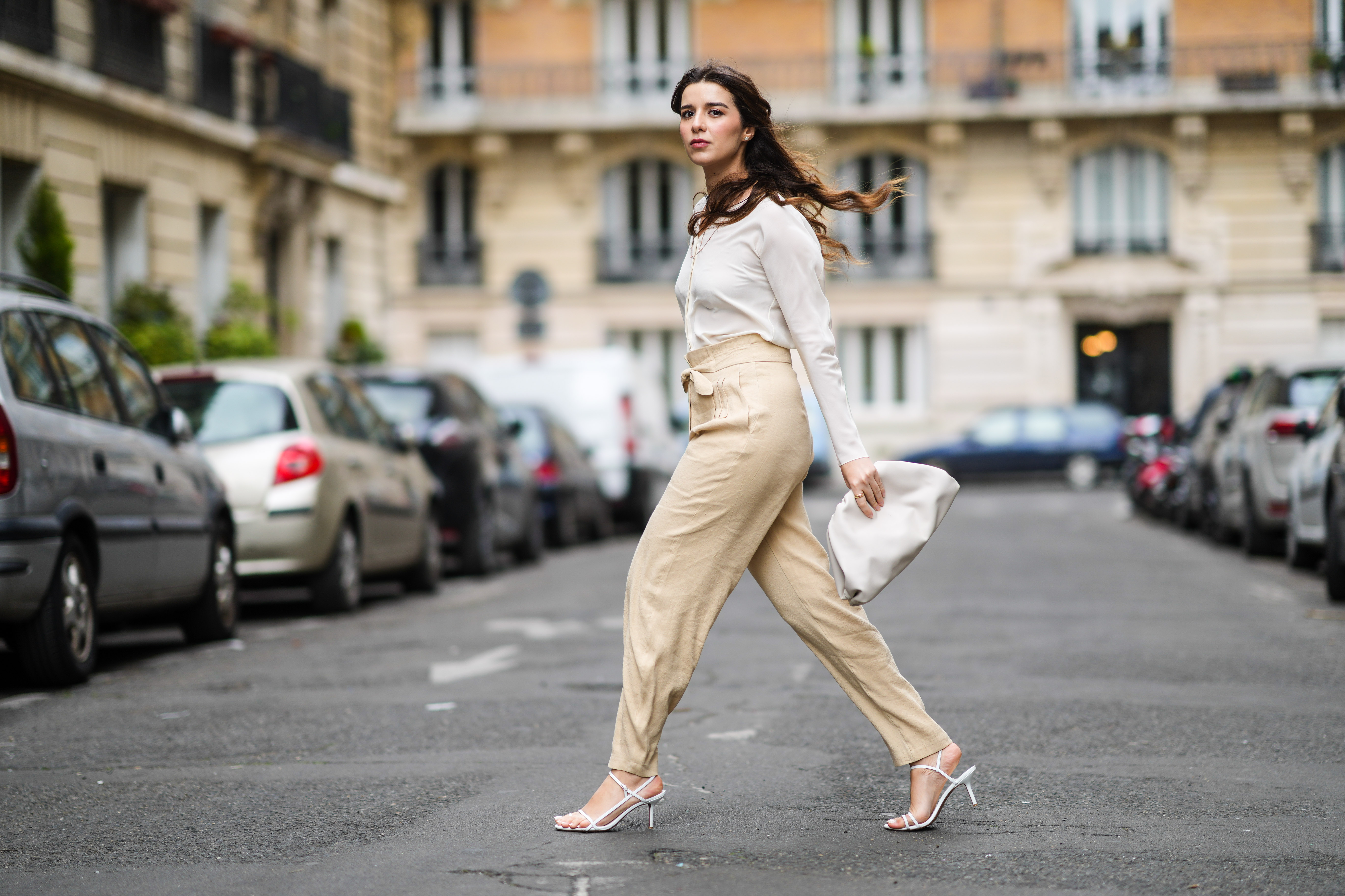 woman wearing white blouse and beige pants