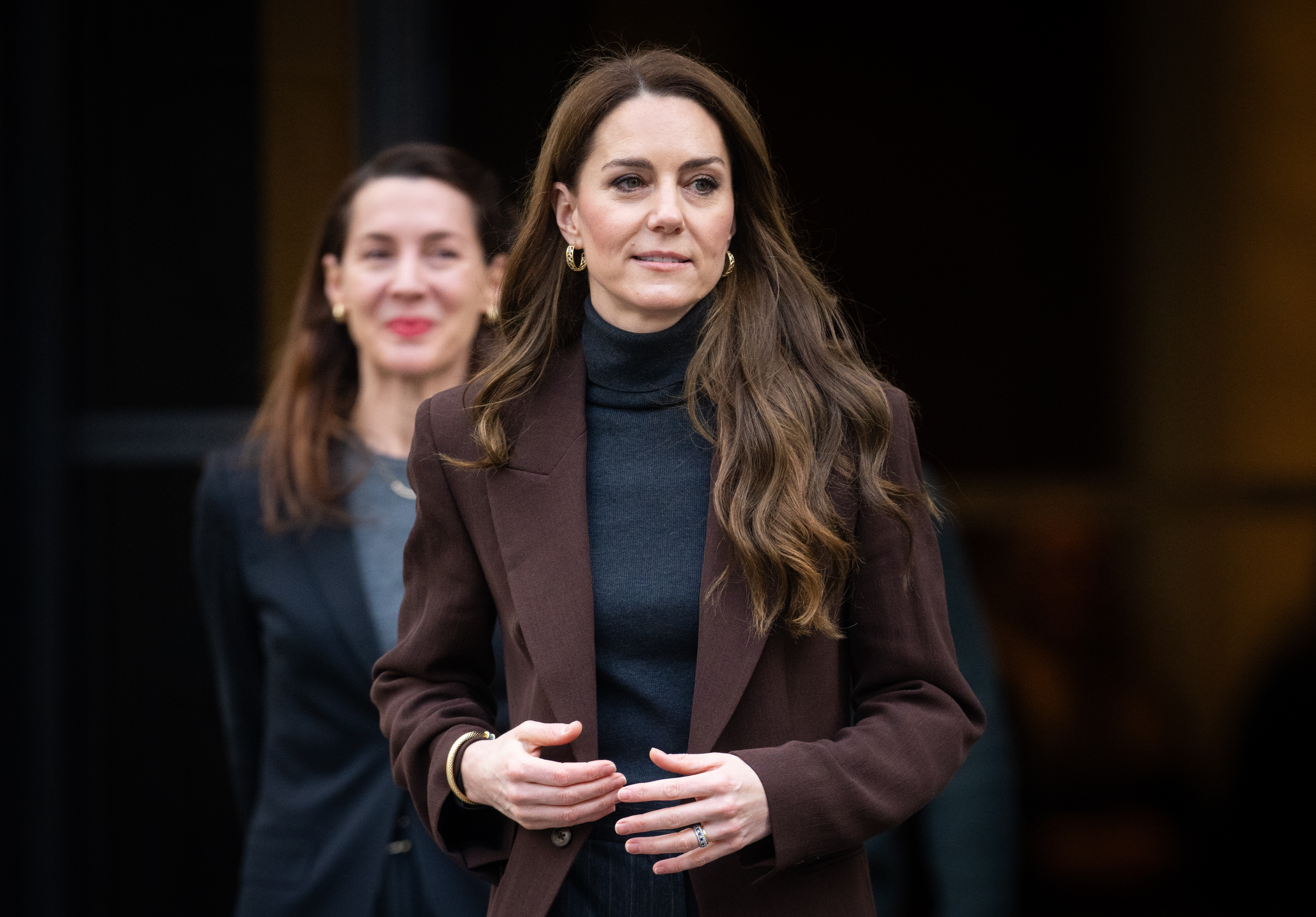 kate middleton wearing brown blazer and gray sweater
