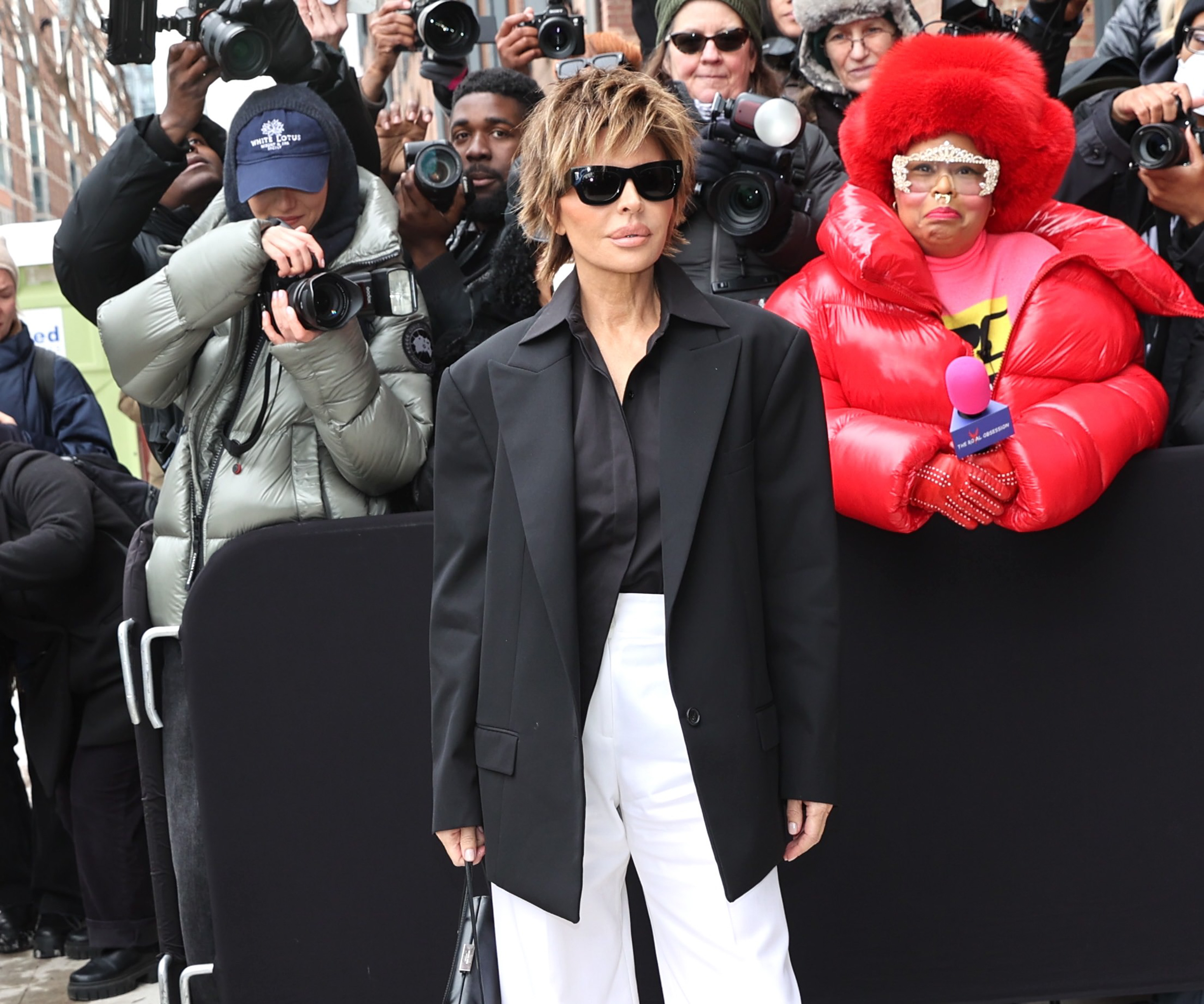 lisa rinna in black blazer and white pants and nyfw