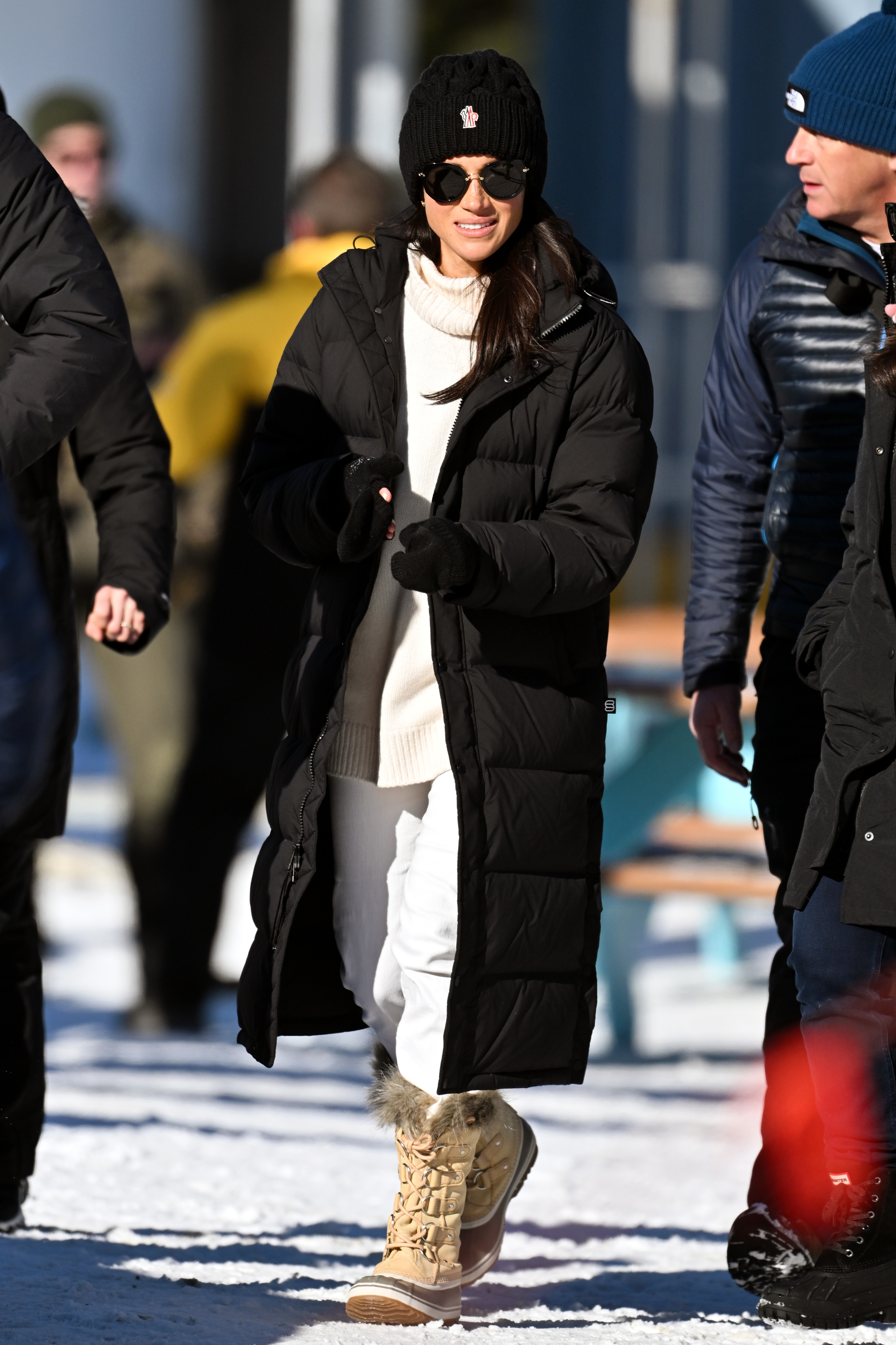 meghan markle in black puffer coat
