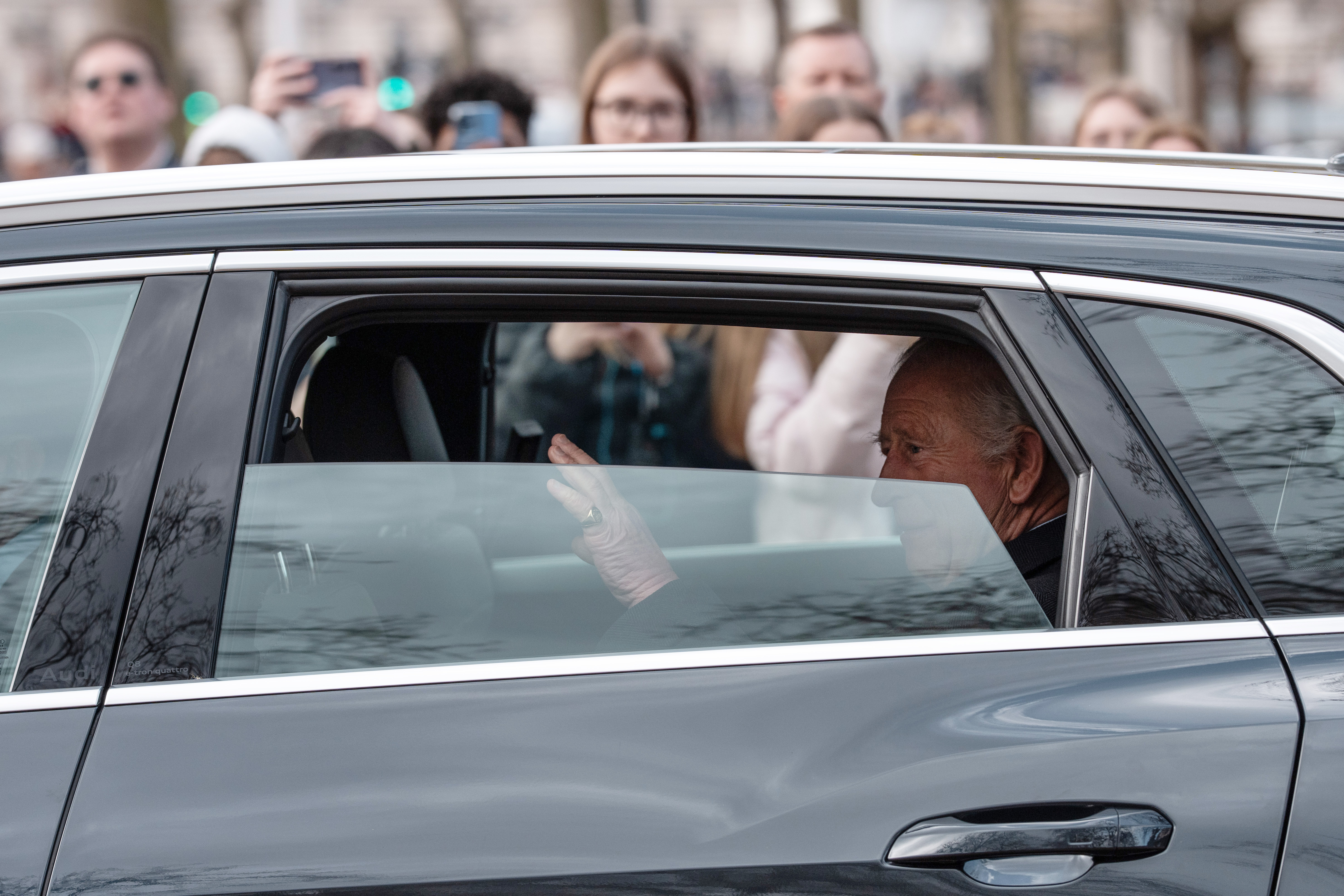 King Charles in a car