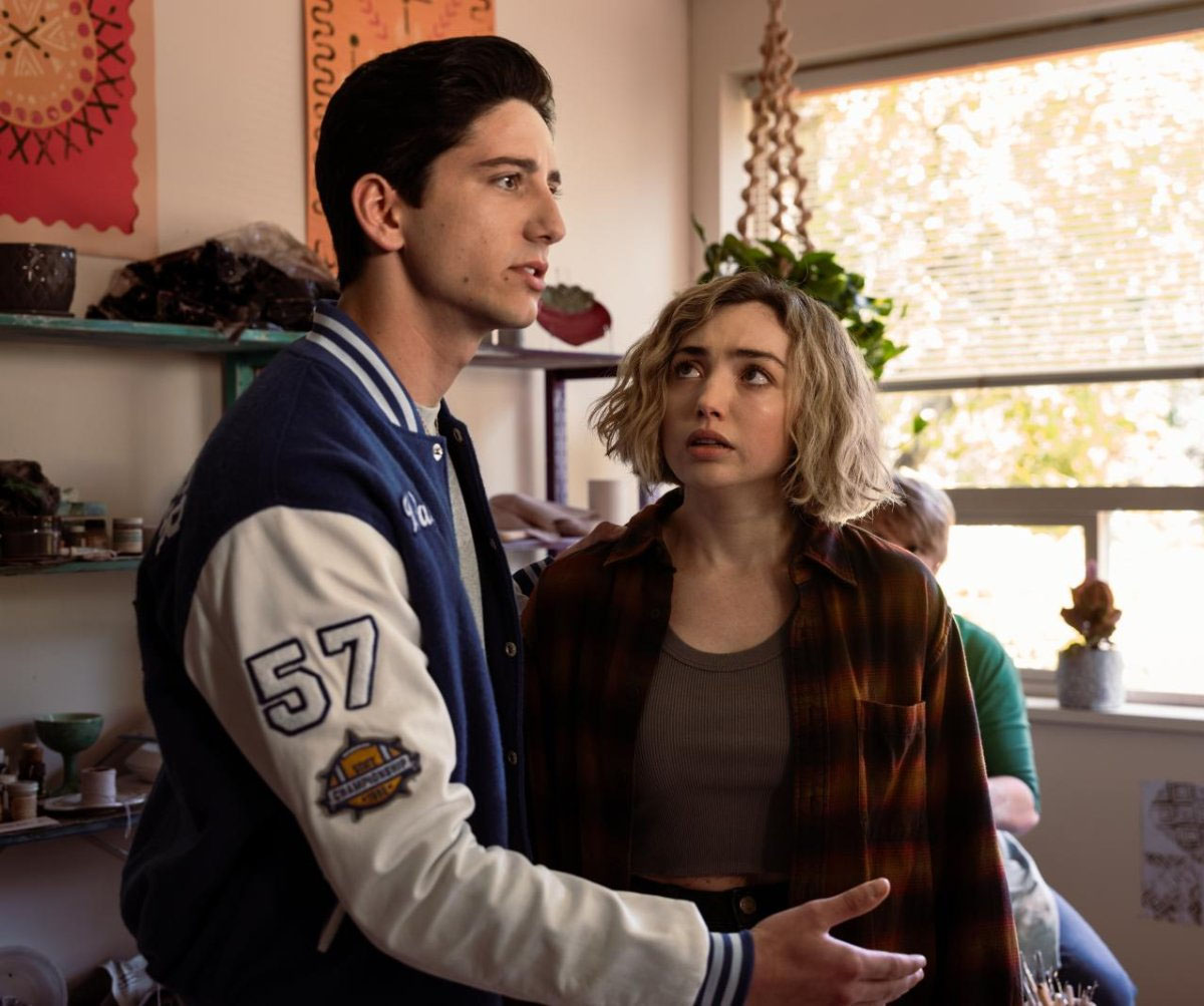 Milo Manheim holds Peyton List in School Spirits.
