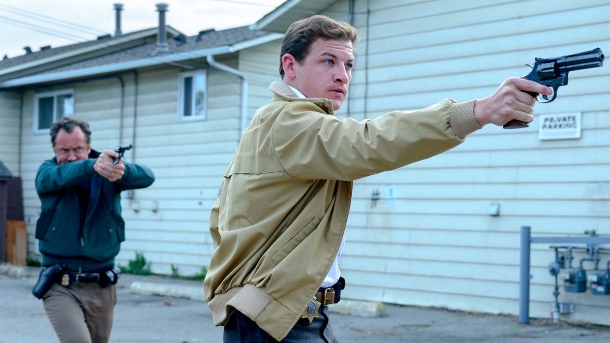 Two cops aim their guns in The Order.