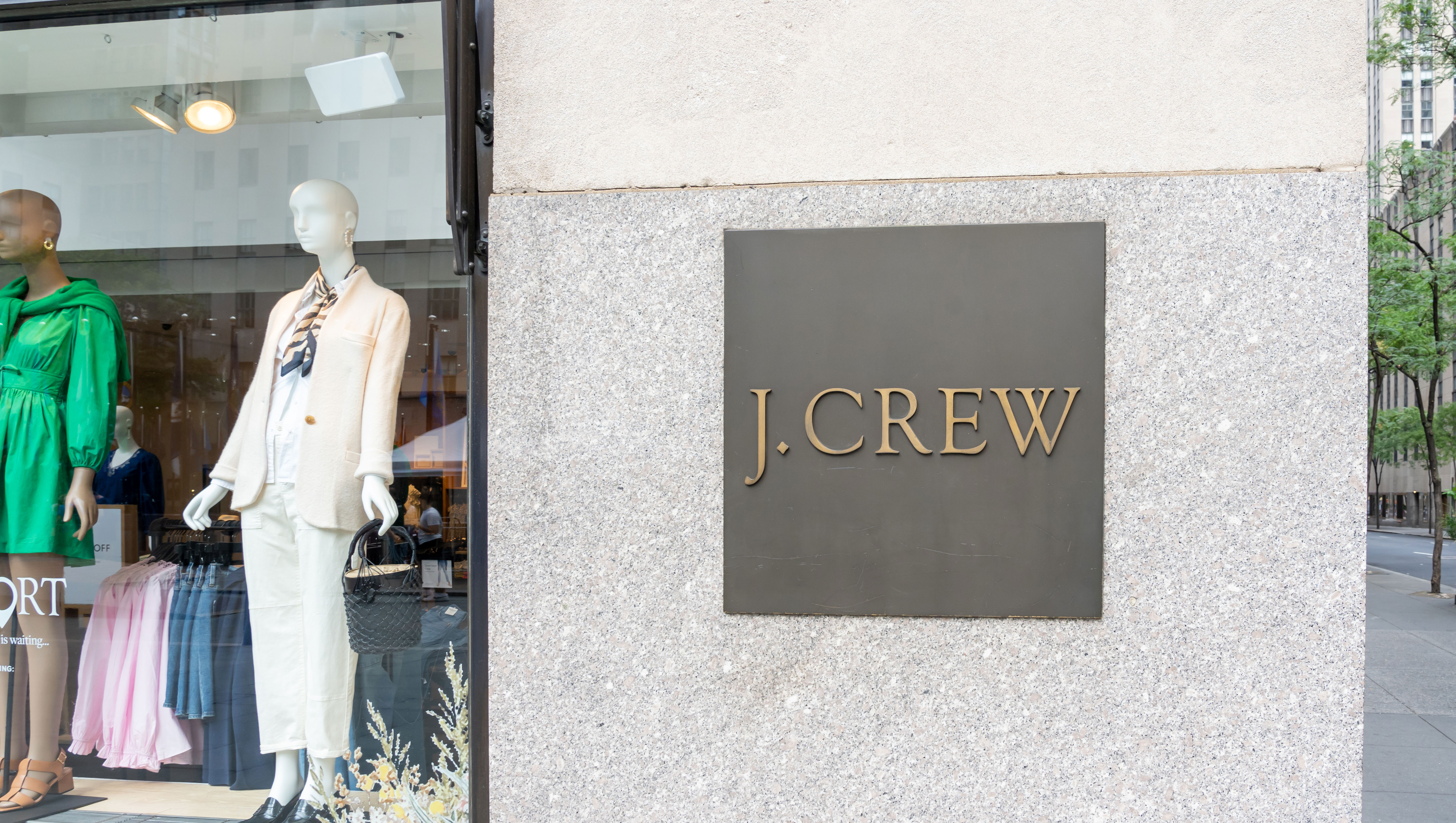 New York City, USA - August 21, 2022: A J.Crew store sign on the building is seen on Fifth Ave. in New York City, USA. J.Crew Group, Inc., is an American multi-brand, multi-channel, specialty retailer.