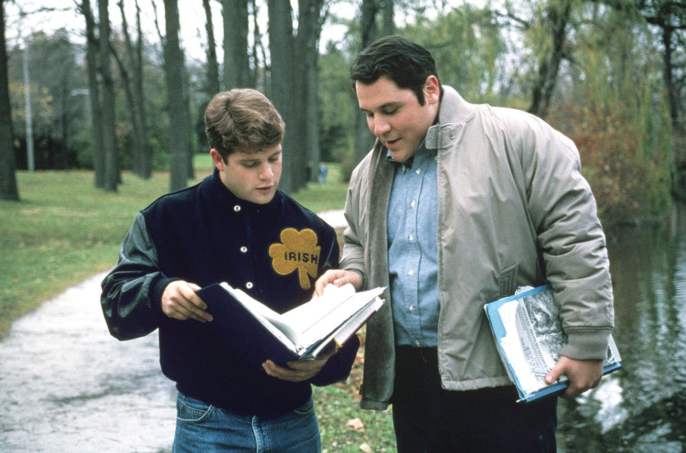 Sean Astin and Jon Favreau go over some notes in Rudy.