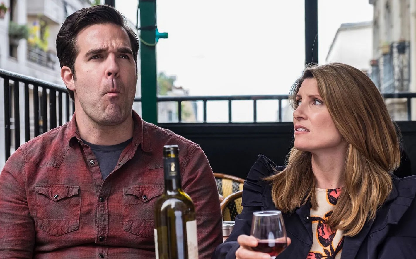 A woman looks at a man in Catastrophe.