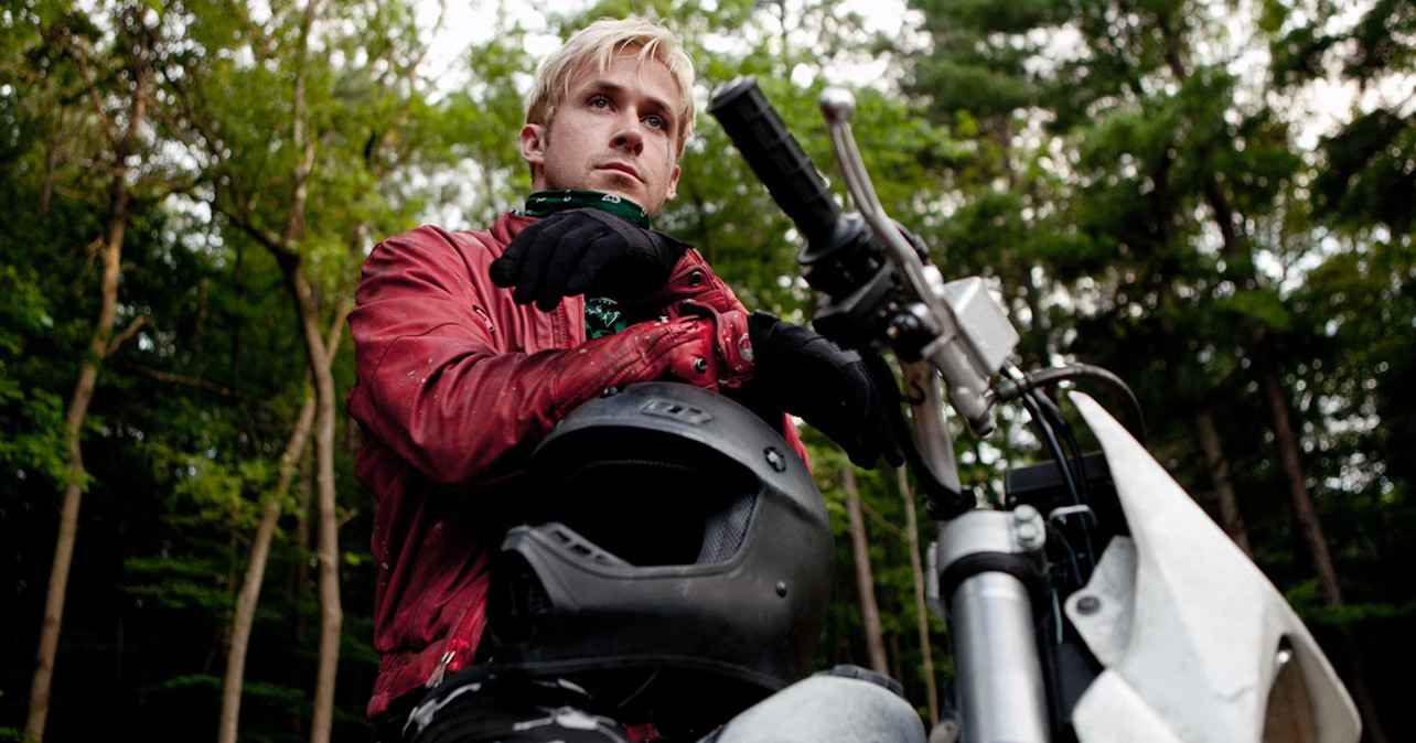 Ryan Gosling sits on a motorcycle in The Place Beyond the Pines.