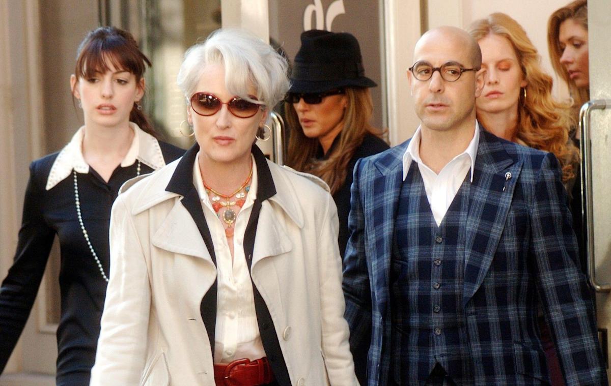 Three people exit a building in 'The Devil Wears Prada.'