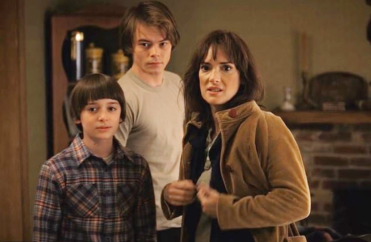 A mother stands with her two sons in 'Stranger Things.'