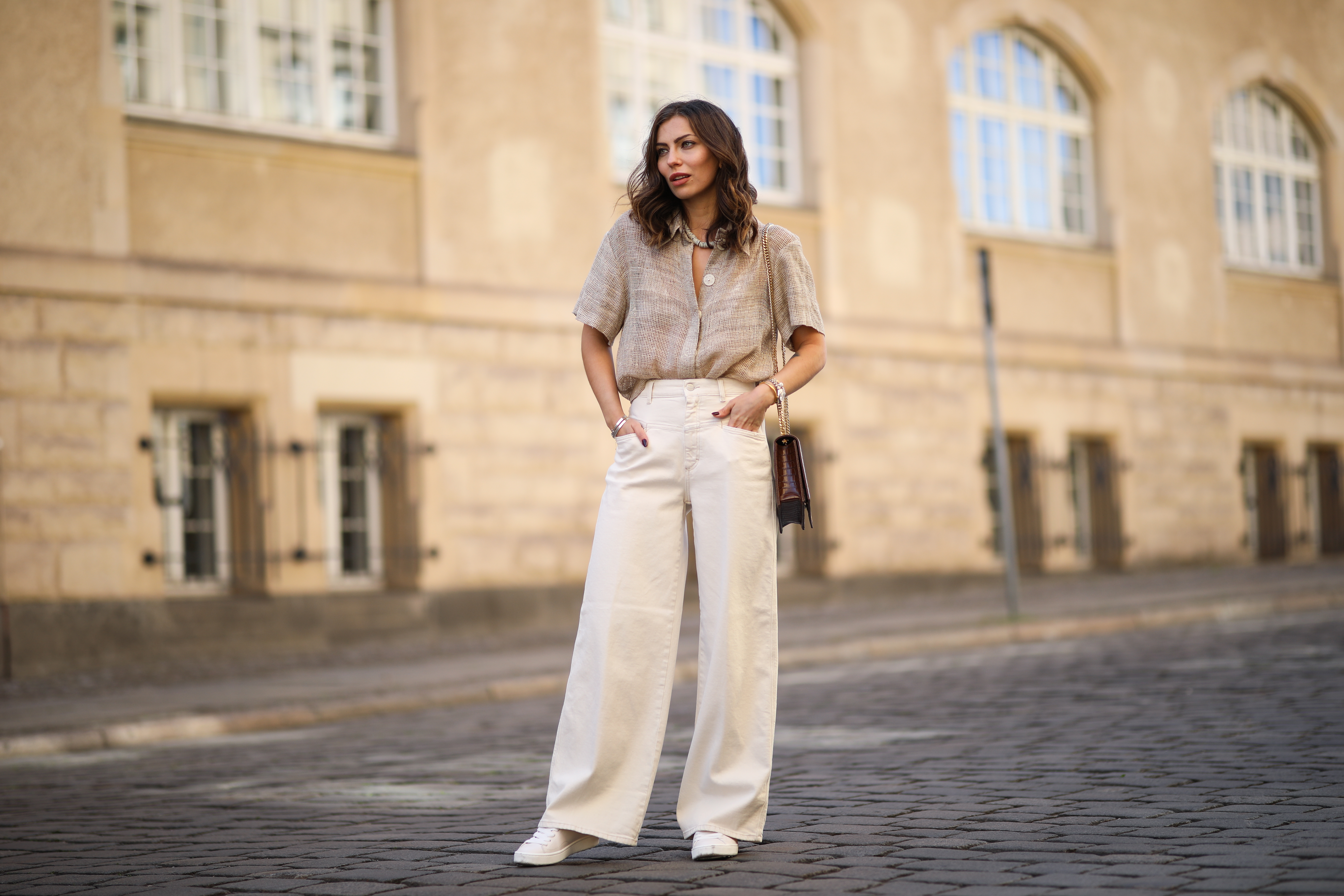 Masha Sedgwick (Maria Astor) wearing Nobi Talai blouse, Agneel bag, Closed jeans and Coach sneaker on May 06, 2020 in Berlin, Germany.