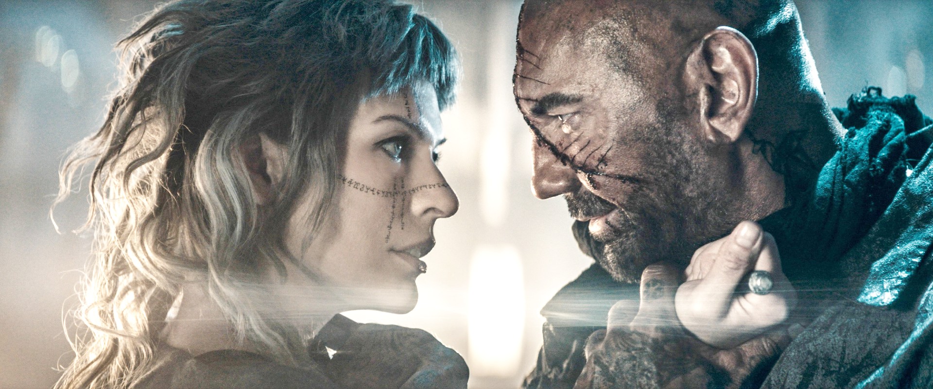 Milla Jovovich and Dave Bautista in In the Lost Lands