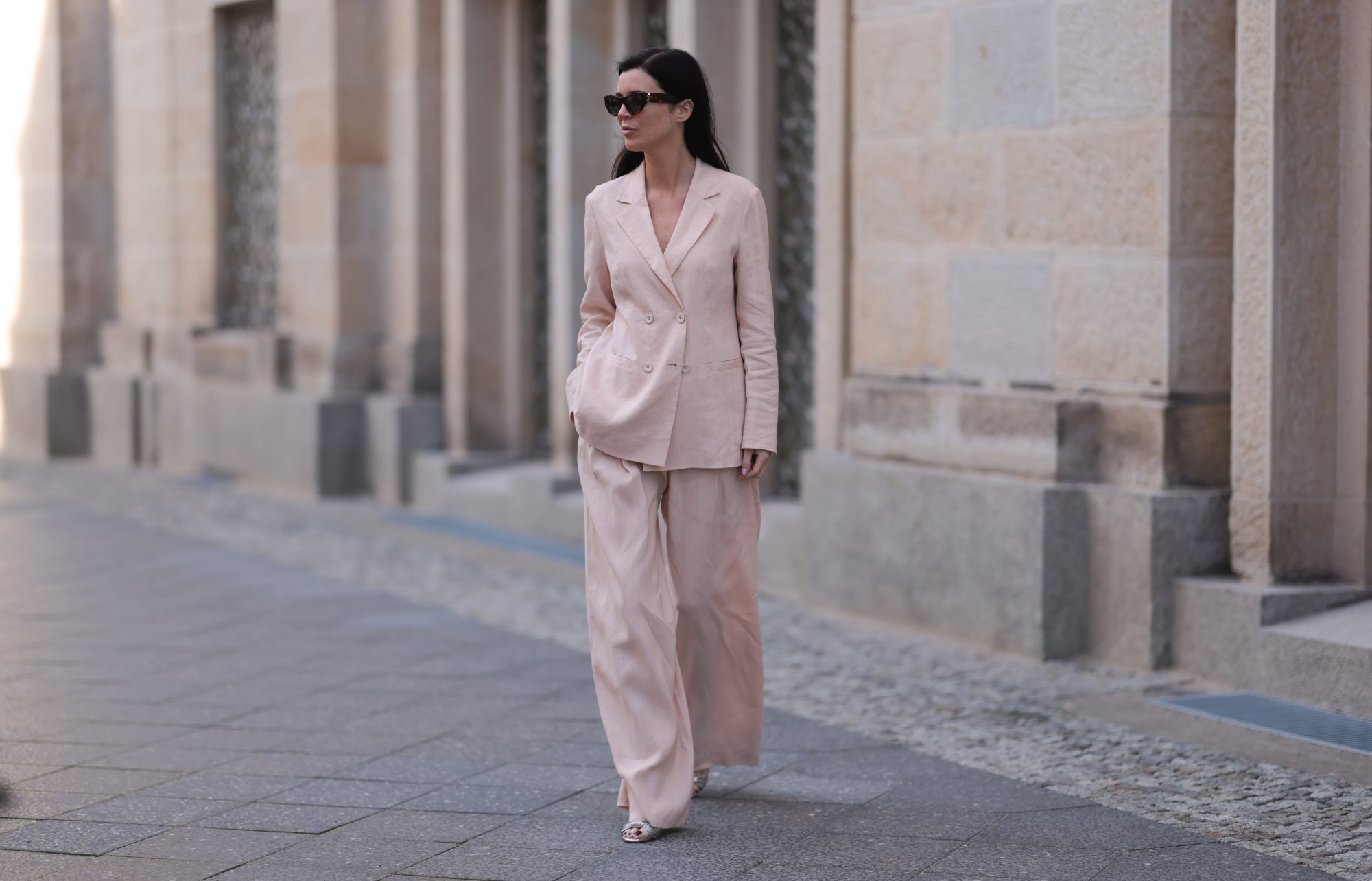 BERLIN, GERMANY - FEBRUARY 25: Leo Eberlin seen wearing YSL brown tortoise sunglasses, Leo Mathild diamond jewelry / rings and bracelet, Marc Cain light pink elegant blazer jacket, matching Marc Cain light pink elegant wide leg suit pants and Marc Cain silver leather heels, on February 25, 2024 in Berlin, Germany. (Photo by Jeremy Moeller/Getty Images)