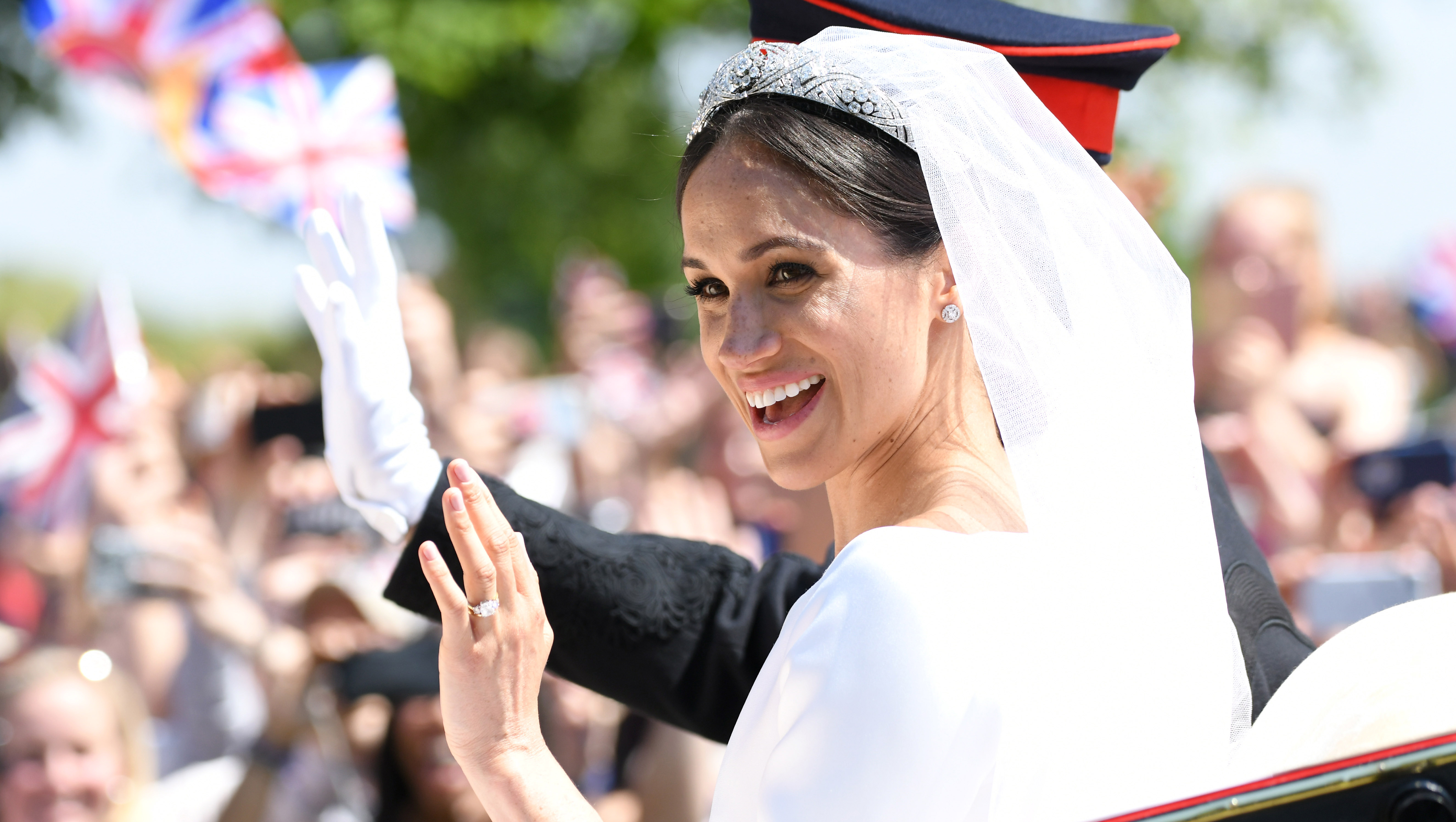 WINDSOR, ENGLAND - MAY 19: Meghan, Duchess of Sussex leaves Windsor Castle in the Ascot Landau carriage during a procession after getting married at St Georges Chapel on May 19, 2018 in Windsor, England. Prince Henry Charles Albert David of Wales marries Ms. Meghan Markle in a service at St George's Chapel inside the grounds of Windsor Castle. Among the guests were 2200 members of the public, the royal family and Ms. Markle's mother, Doria Ragland. (Photo by Karwai Tang/WireImage)