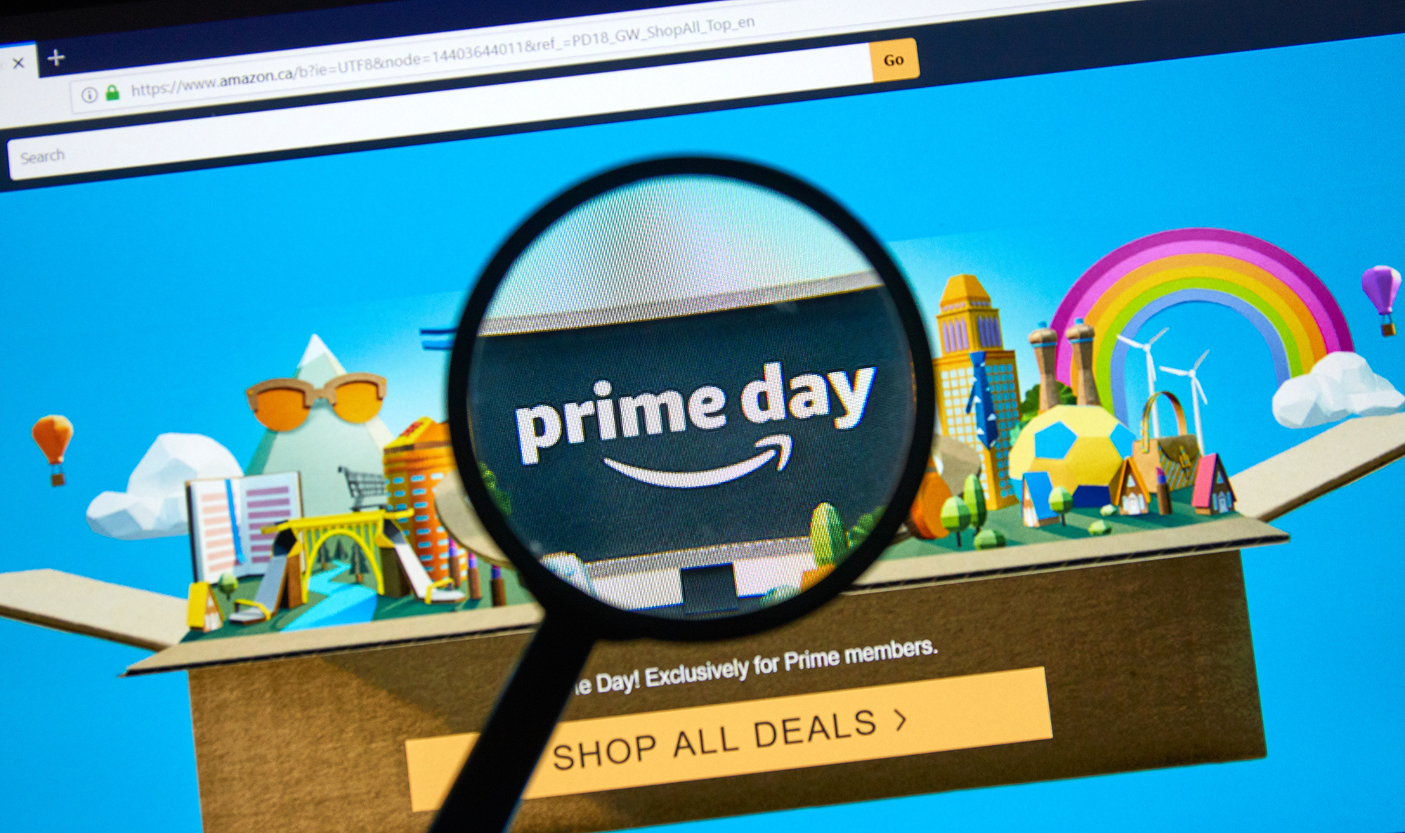 MONTREAL, CANADA - JUNE 9, 2019 : Amazon prime day page on official amazon site under magnifying glass. Amazon Prime Day is the retailer's big members-only summer sale in month of July each year.; Shutterstock ID 1419761333; purchase_order: -; job: -; client: -; other: -