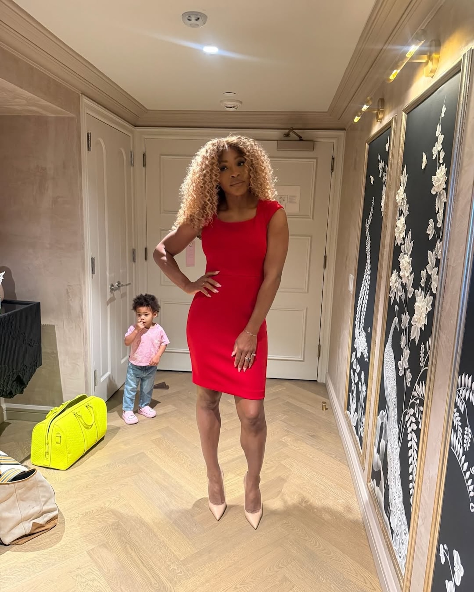 Serena Williams’ Daughter Hilariously Photobombs Her While Posing in a Hot Red Dress