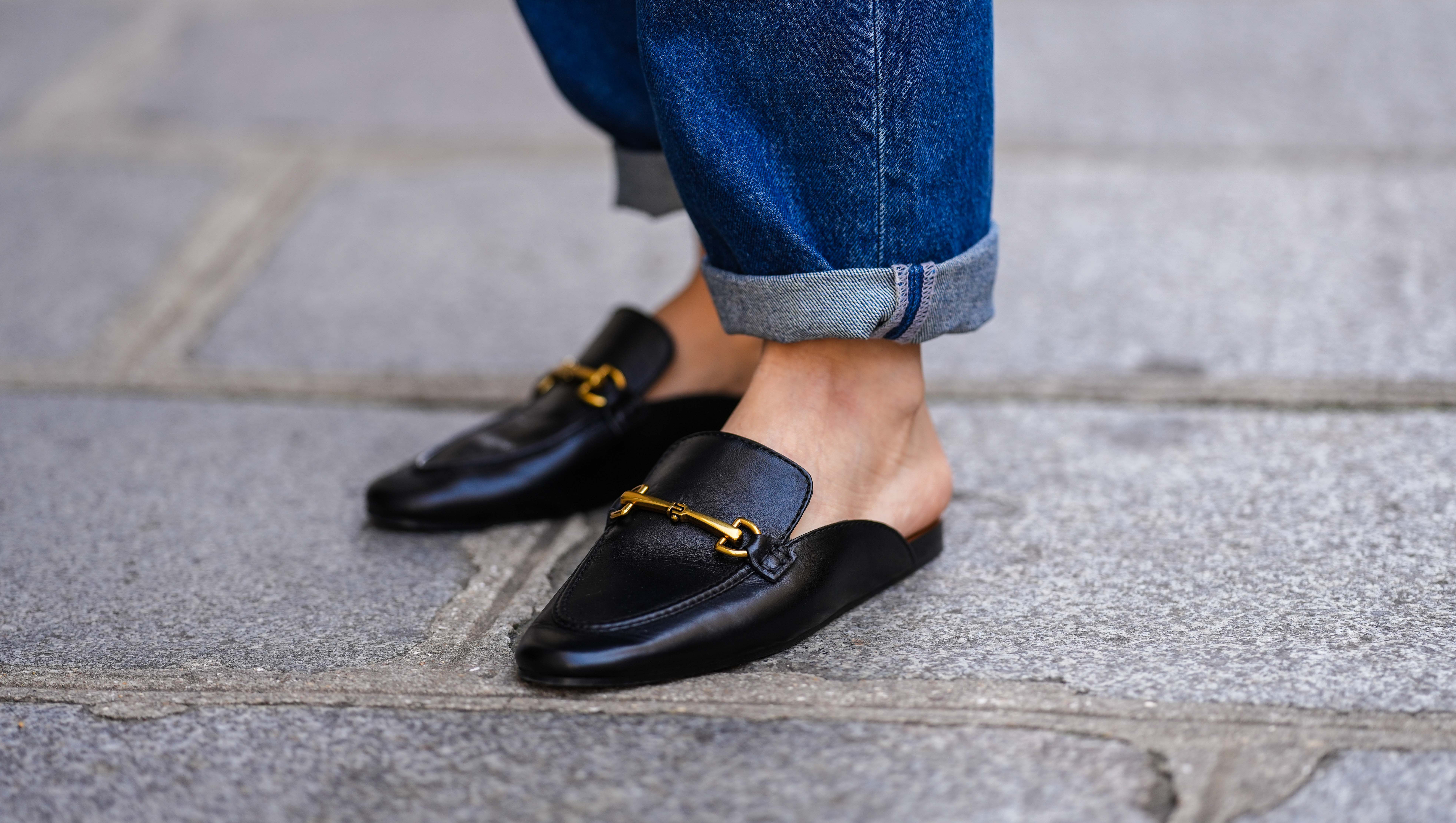 PARIS, FRANCE - APRIL 15: Diane Batoukina @diaanebt wears navy blue denim rolled-up large pants from Rouje, black shiny leather loafers mules from Massimo Dutti, during a street style fashion photo session, on April 15, 2022 in Paris, France. (Photo by Edward Berthelot/Getty Images)