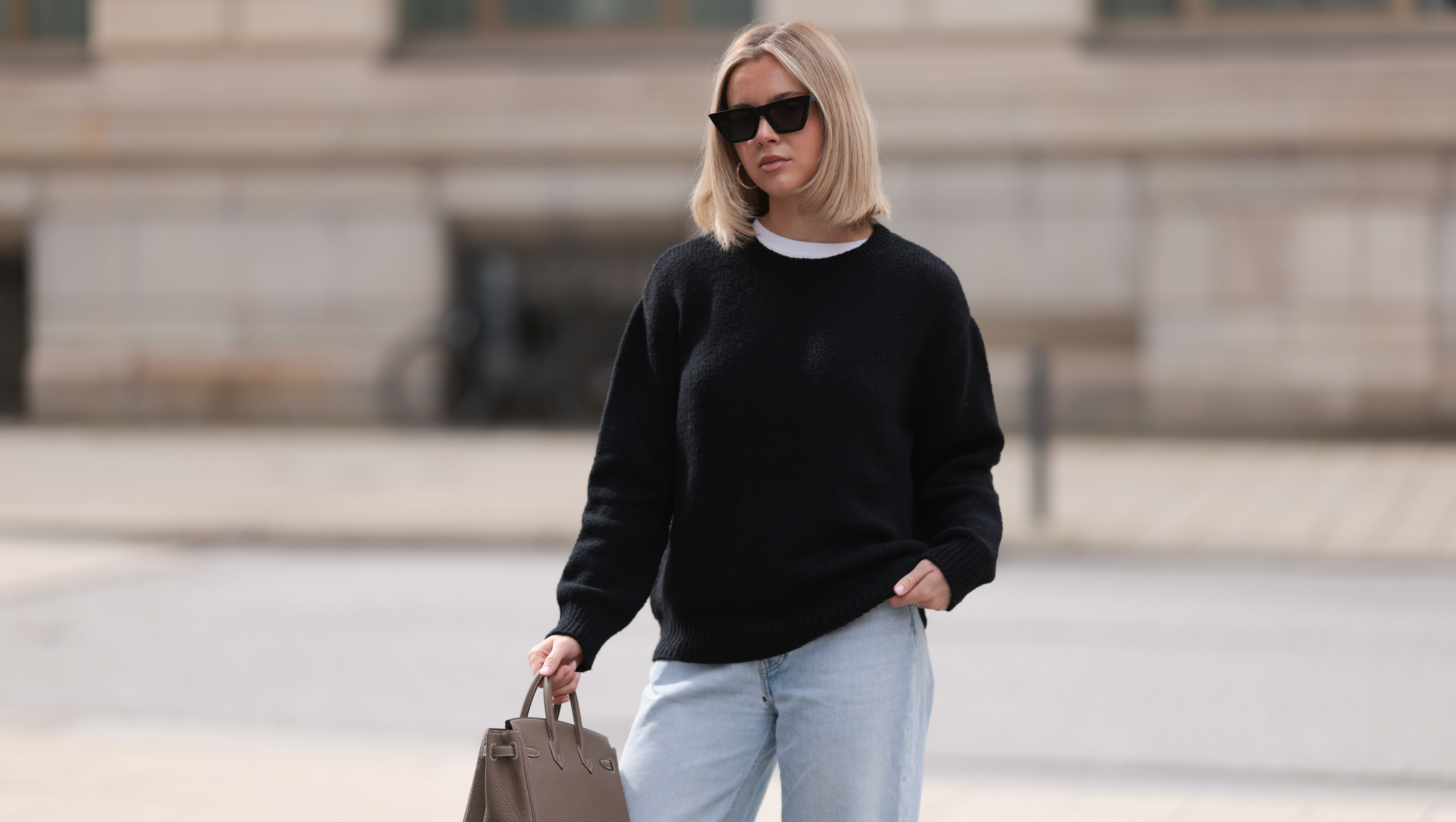 HAMBURG, GERMANY - APRIL 05: Isabelle Hartmann seen wearing Celine black sunglasses, Almada Label black cashmere wool knit sweater, Levi’s light blue vintage denim and Hermès Birkin 25 brown / taupe leather handbag on April 05, 2024 in Hamburg, Germany. (Photo by Jeremy Moeller/Getty Images)