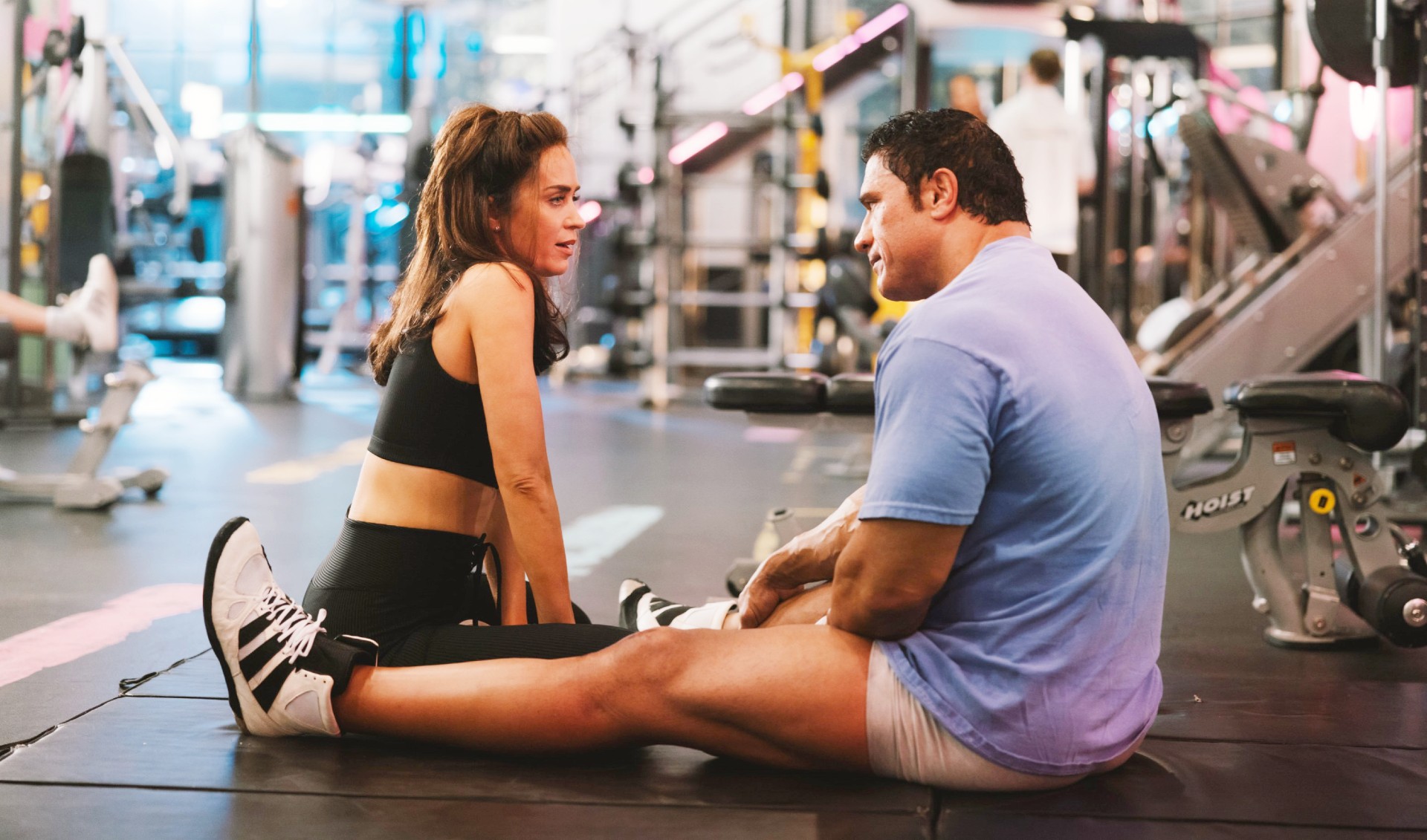 Emily Blunt as Dawn Staples, Dwayne Johnson as Mark Kerr in The Smashing Machine