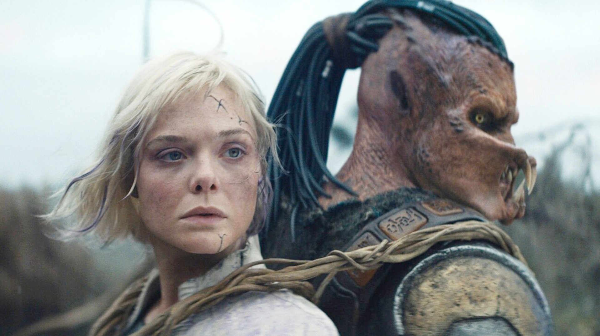 Elle Fanning and Dimitrius Schuster-Koloamatangi in Predator: Badlands