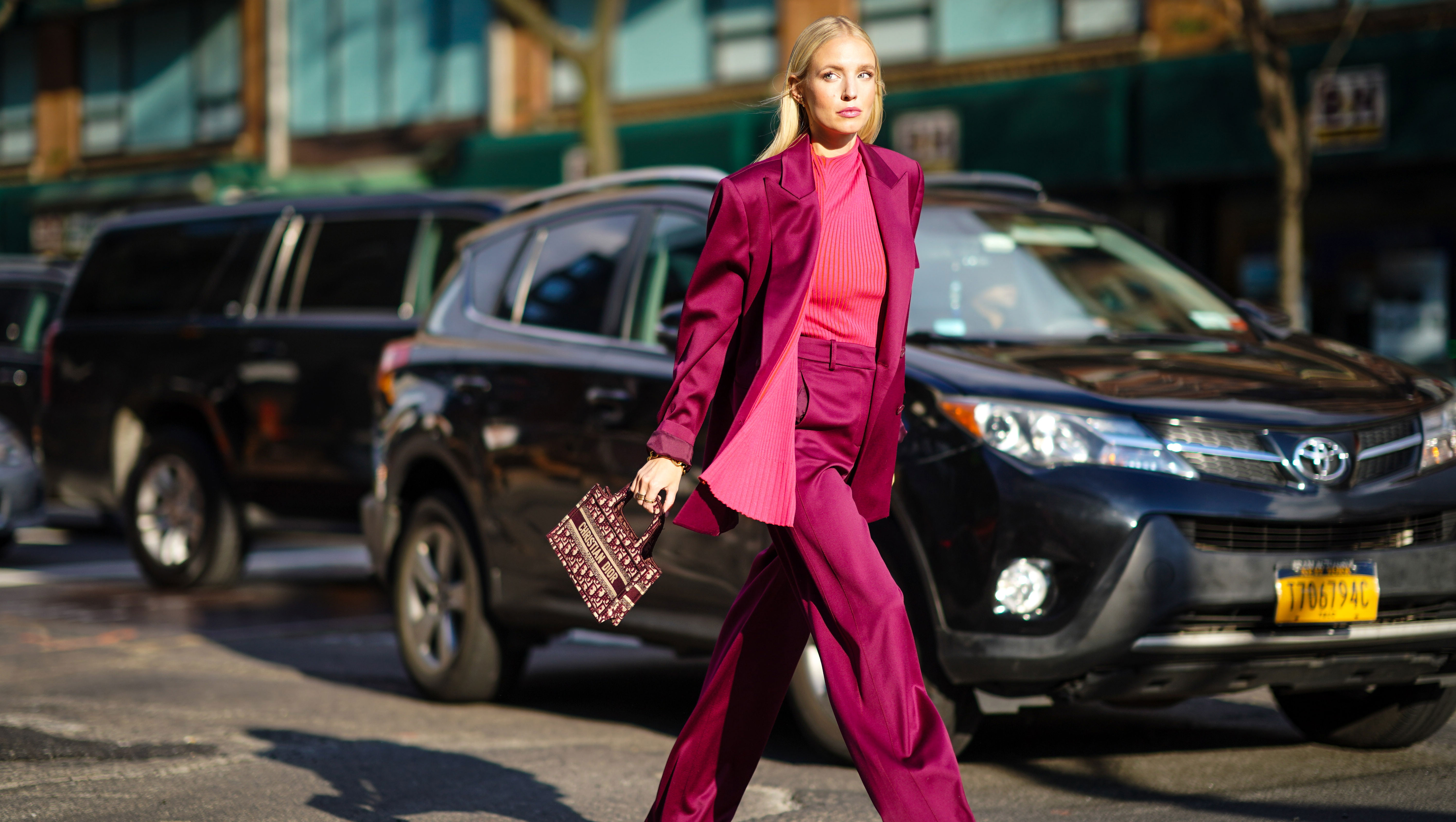 NEW YORK, NEW YORK - FEBRUARY 09: Leonie Hanne wears a purple lustrous silky oversized blazer jacket, a pink striped top, flared pants, pink sandals, a Christian Dior mini tote bag, outside Sies Marjan, during New York Fashion Week Fall Winter 2020, on February 09, 2020 in New York City. (Photo by Edward Berthelot/Getty Images)