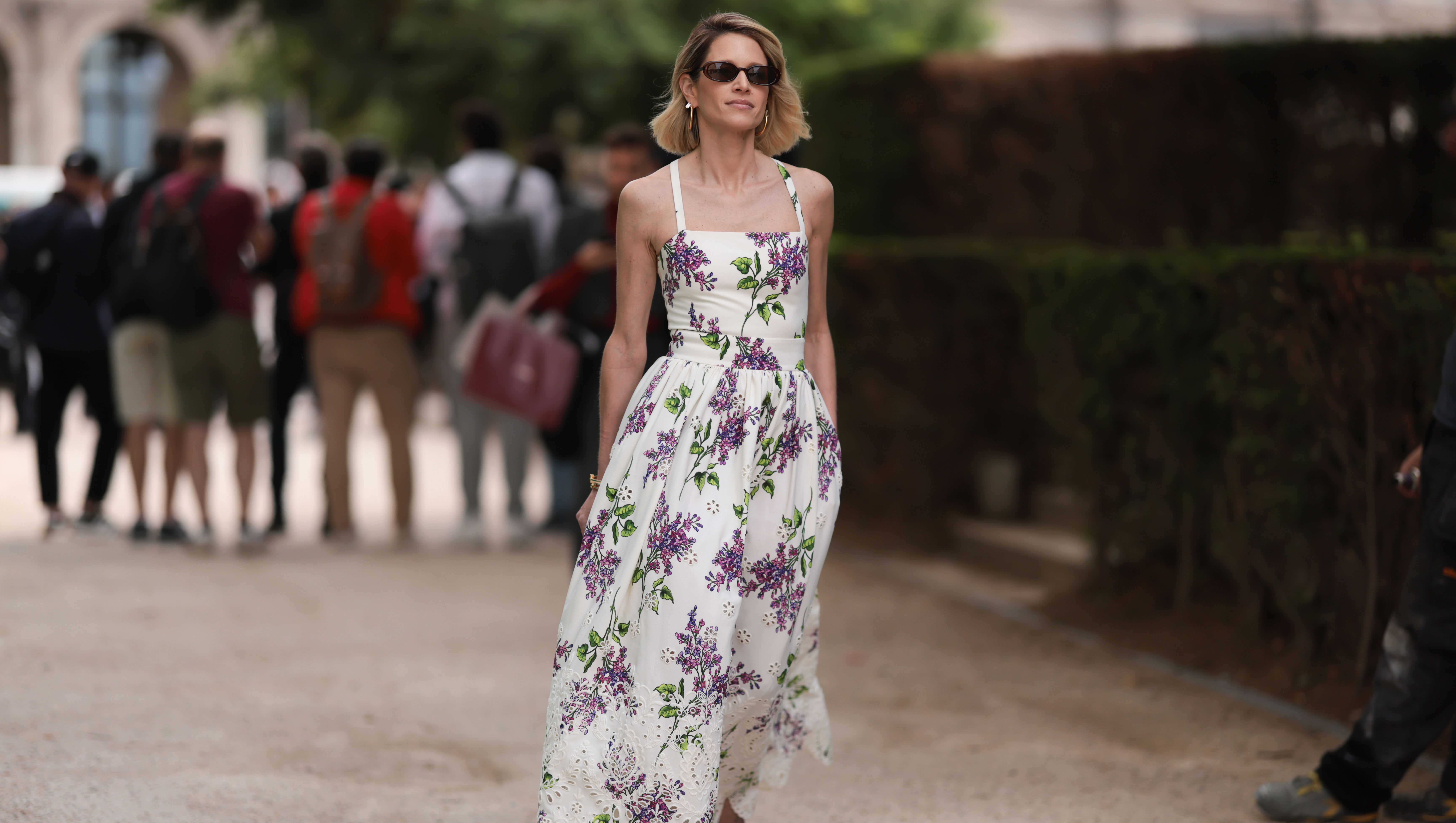PARIS, FRANCE - JULY 05: Helena Bordon seen outside Elie Saab show wearing black small sunnies, shoulder strap white lace dress with lilac flower details and lilac heels during the Haute Couture Fall/Winter 2023/2024 as part of Paris Fashion Week on July 05, 2023 in Paris, France. (Photo by Jeremy Moeller/Getty Images)