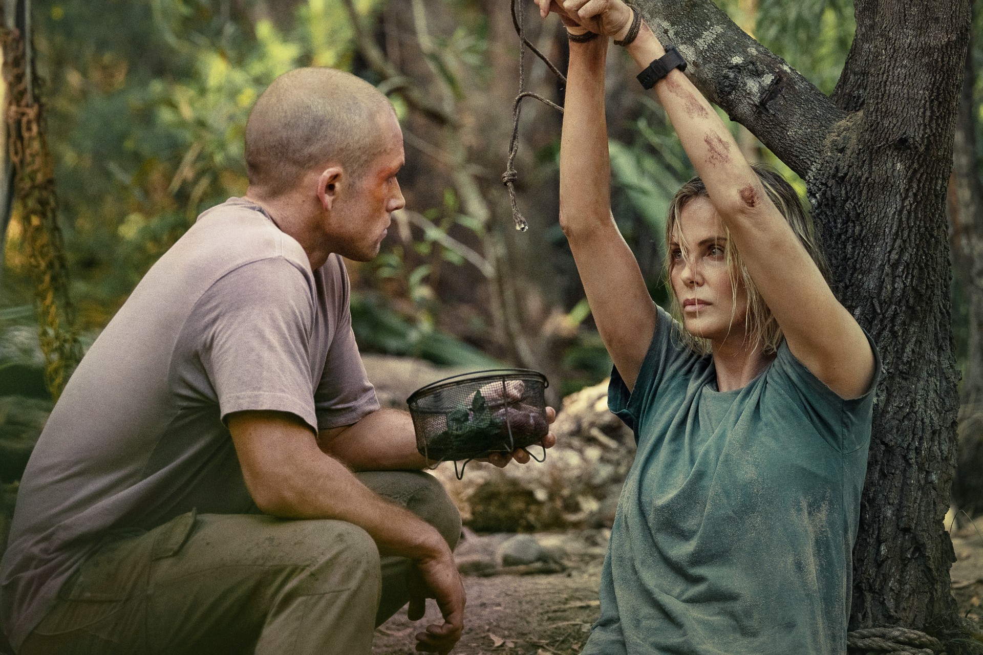Taron Egerton as Ben and Charlize Theron as Sasha in Apex