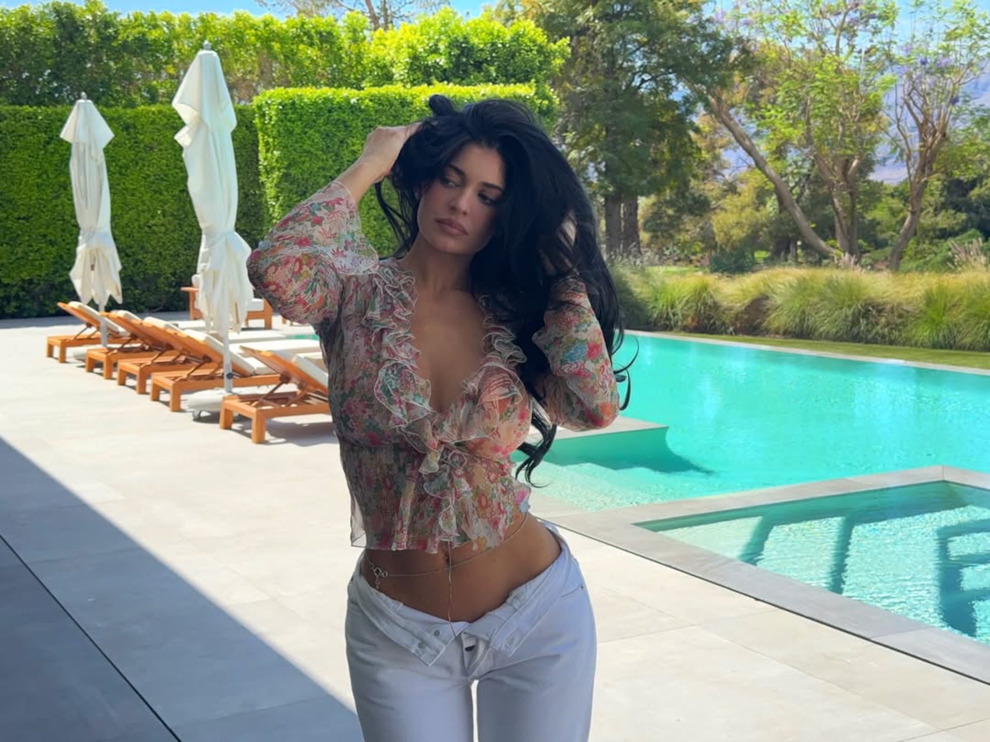 Kylie Jenner Pairs a Belly Chain With Unbuttoned Jeans and a Plunging Top While Celebrating Easter