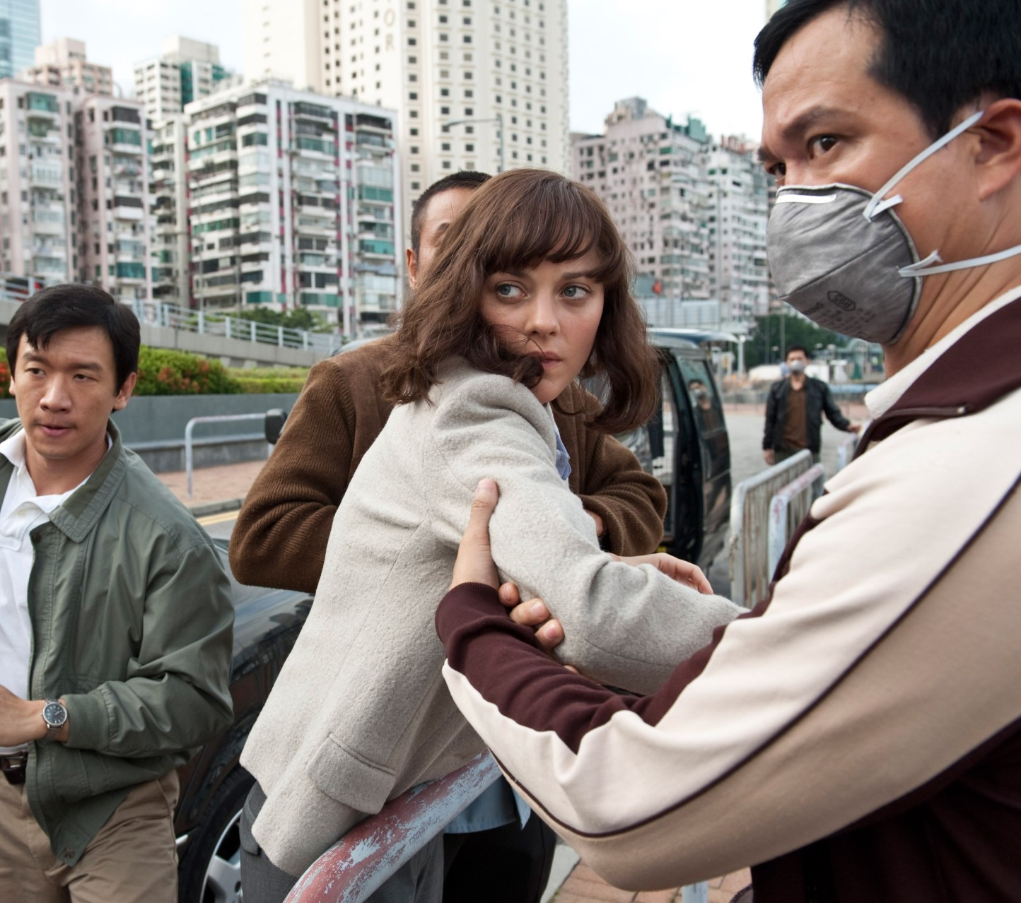 Chin Han (left), Marion Cotillard (center) in Contagion