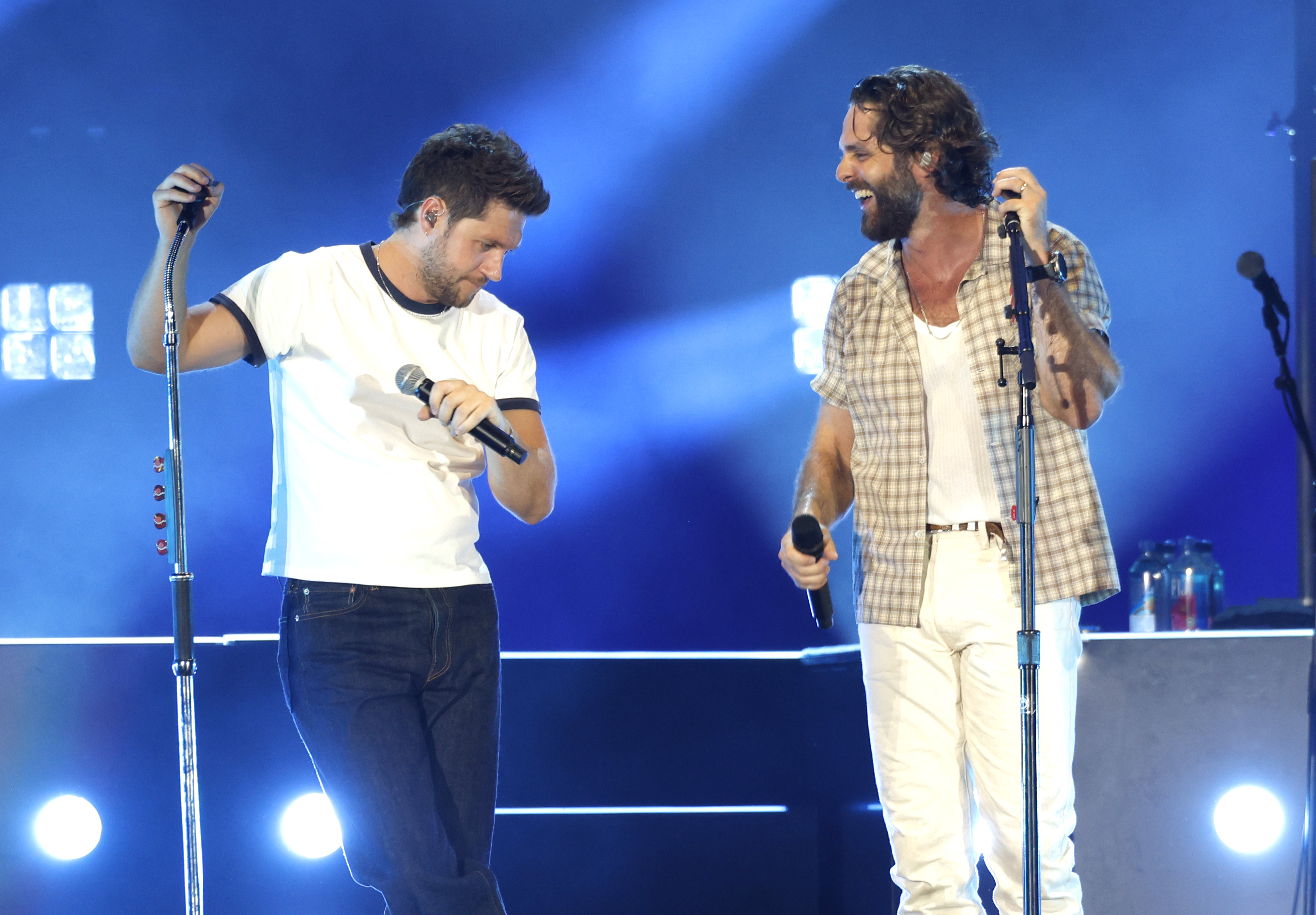 Niall Horan and Thomas Rhett performing together at Geodis Park in Nashville.