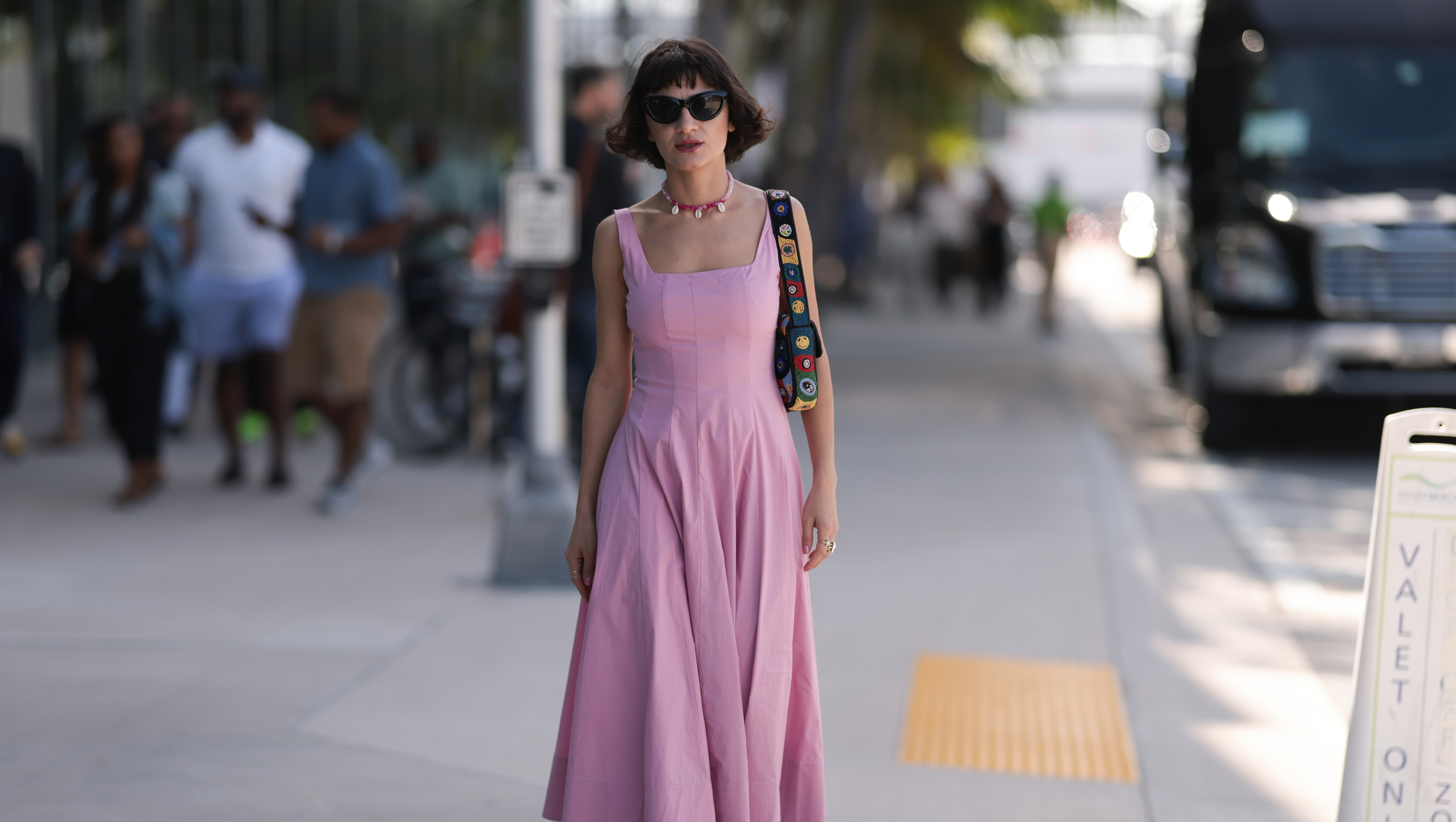 MIAMI, FLORIDA - DECEMBER 02: Fidan Ilham seen wearing a pink pleated longdress with plateau heels and a colourful bag on December 02, 2022 in Miami, Florida. (Photo by Jeremy Moeller/Getty Images)