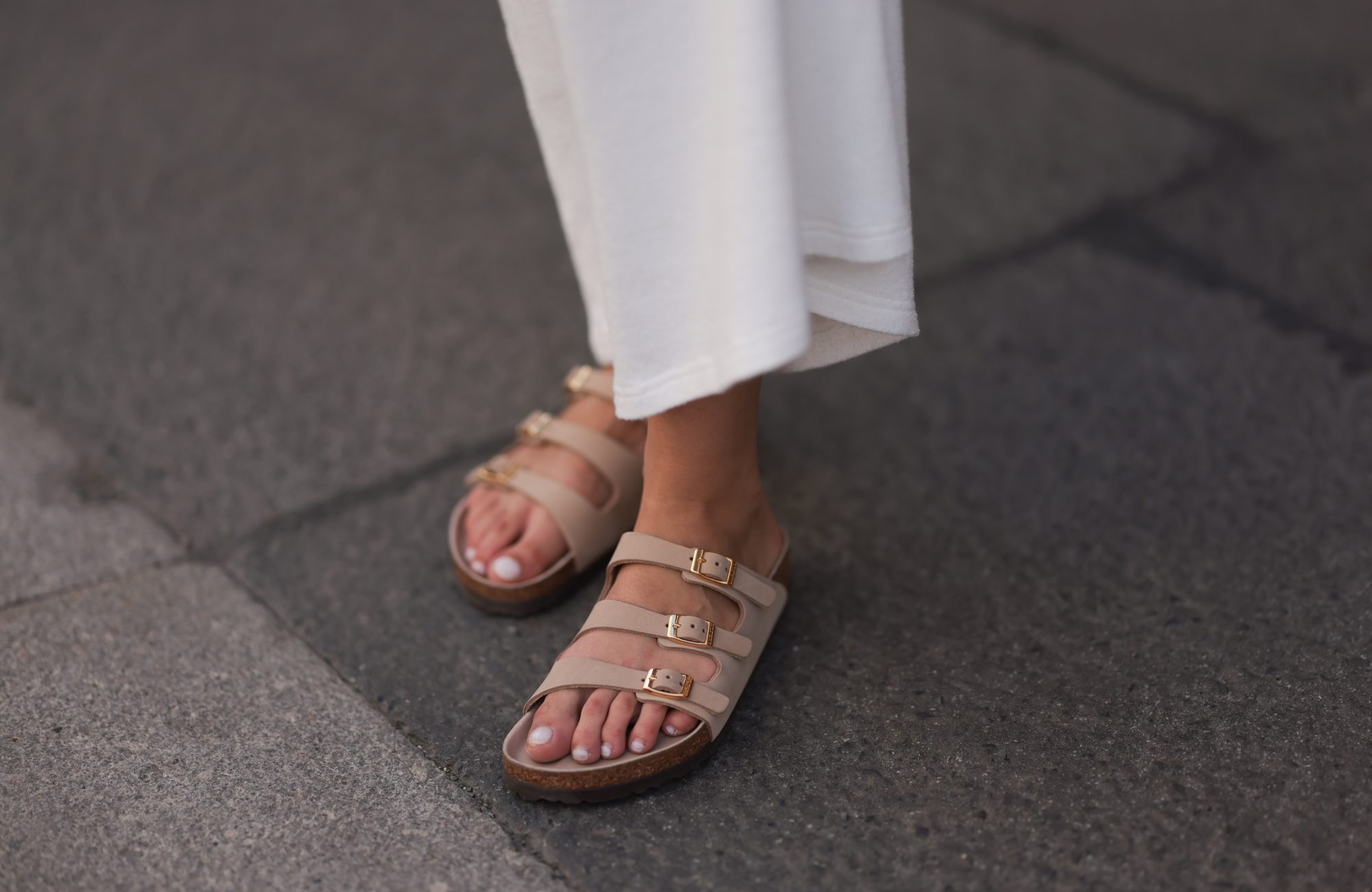 BERLIN, GERMANY - MAY 20: Sophia Geiss is seen wearing a white maxi dress from Blackpalms, and sand-colored "Florida" strap sandals from Birkenstock on May 20, 2025 in Berlin, Germany. (Photo by Jeremy Moeller/Getty Images)