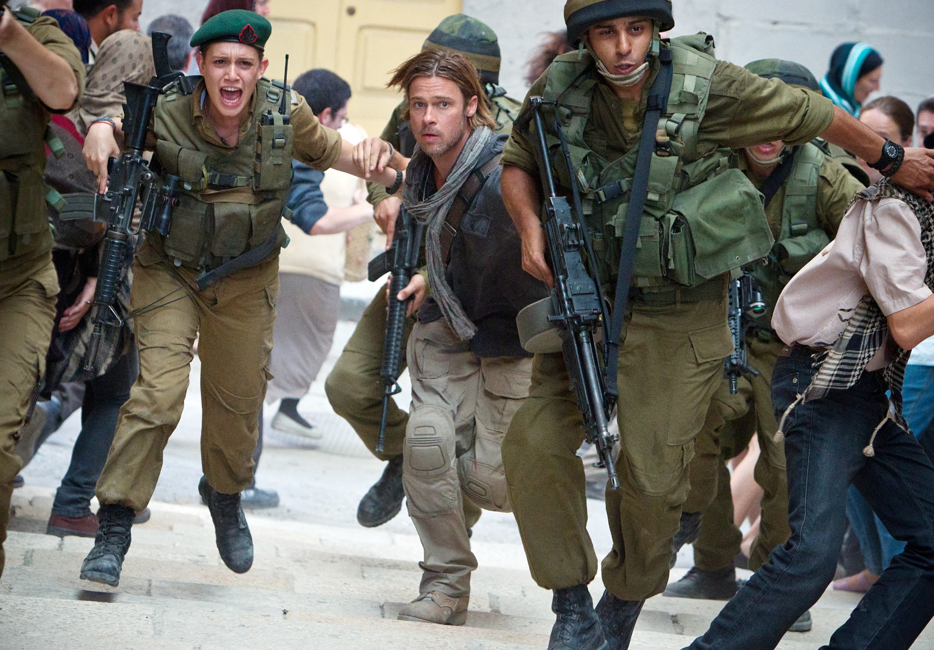 Daniella Kertesz (beret), Brad Pitt (with scarf) in World War Z