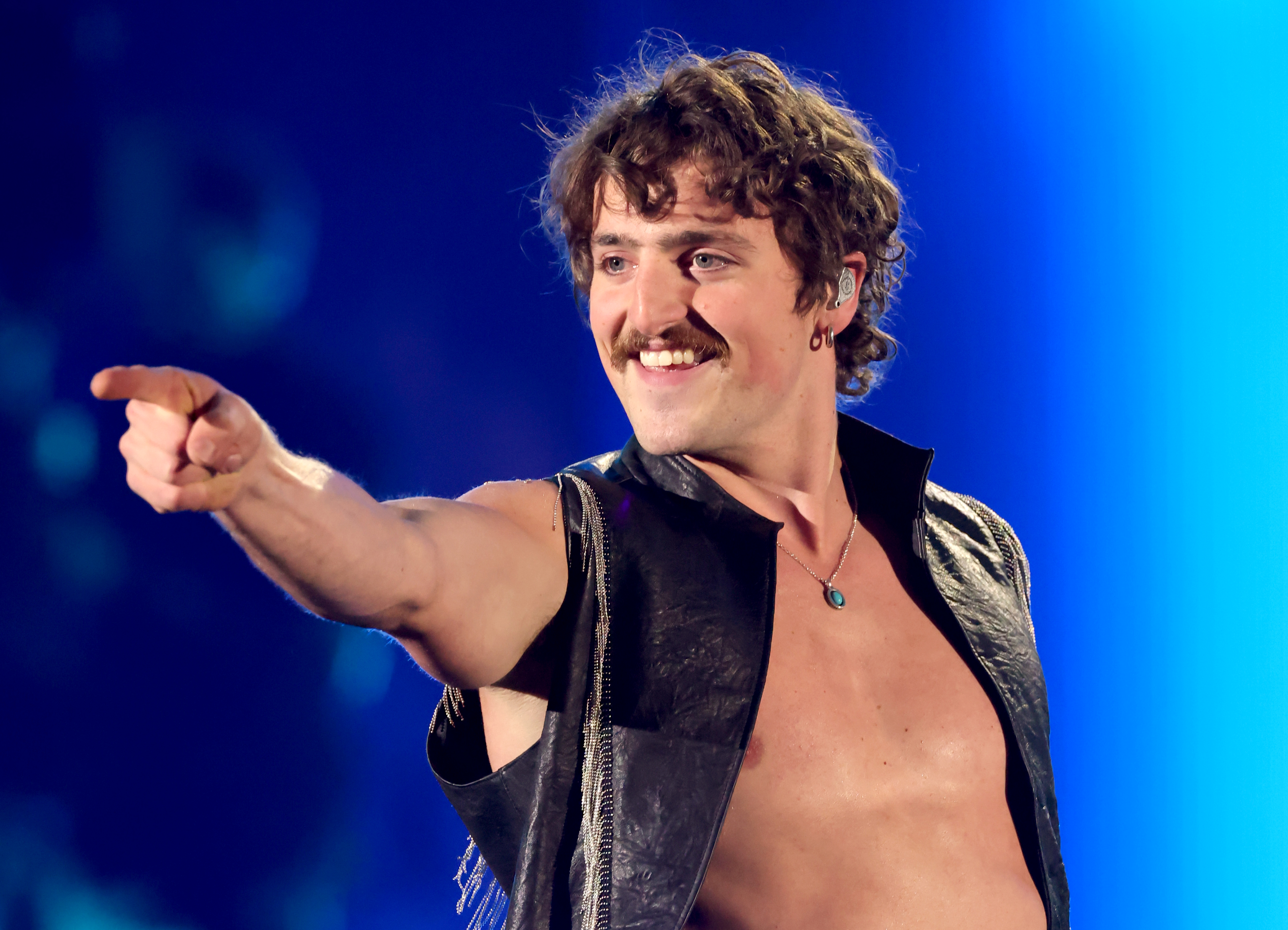 Benson Boone pointing while performing at the 2026 iHeartRadio Music Festival.