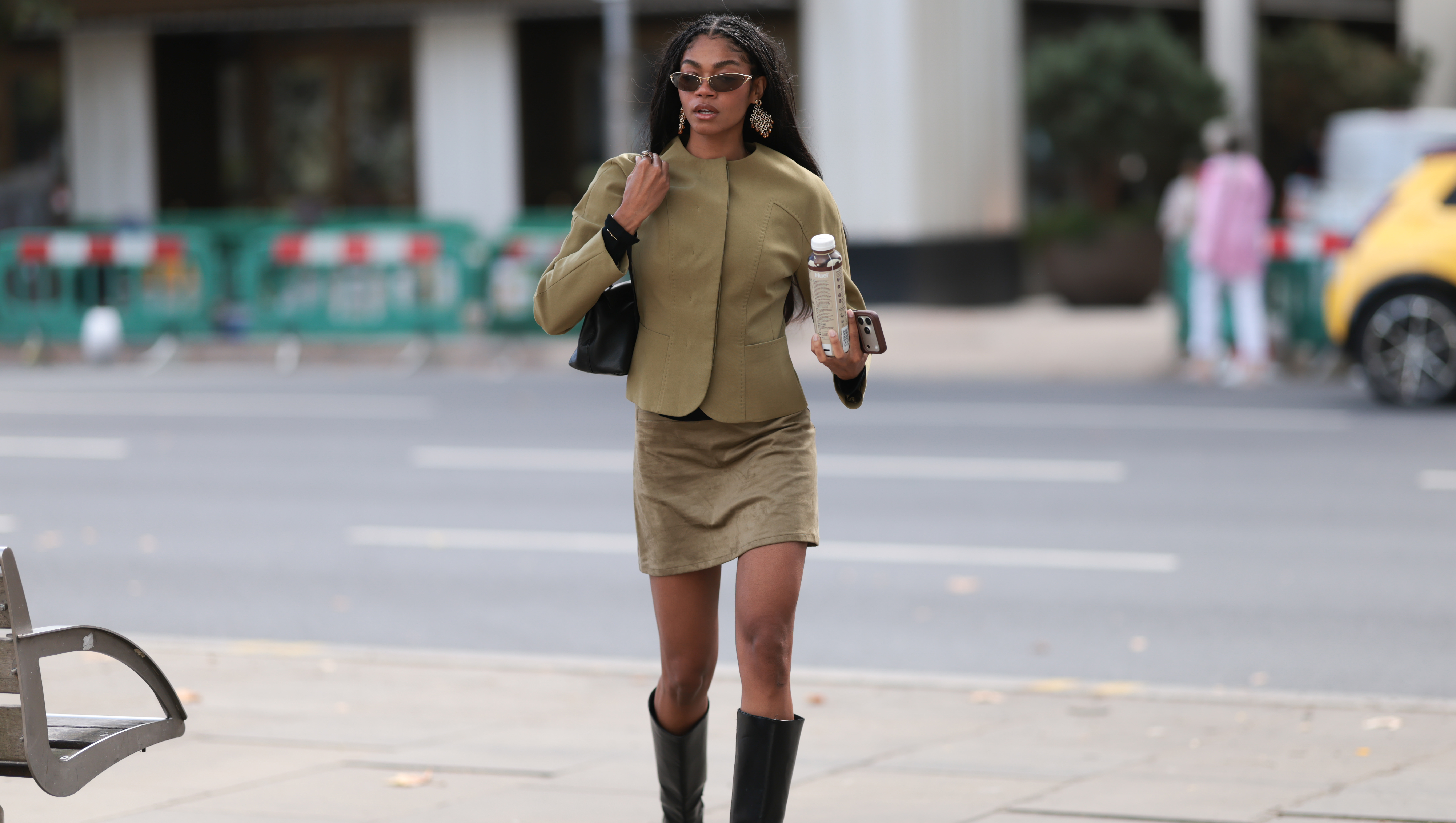 LONDON, ENGLAND - SEPTEMBER 18: Maureen Adim is wearing a khaki tailored jacket, matching suede mini skirt, black knee-high boots, black shoulder bag and narrow brown sunglasses outside the Marks and Spencer Show during London Fashion Week September 2026 on September 18, 2026 in London, England. (Photo by Jeremy Moeller/Getty Images)