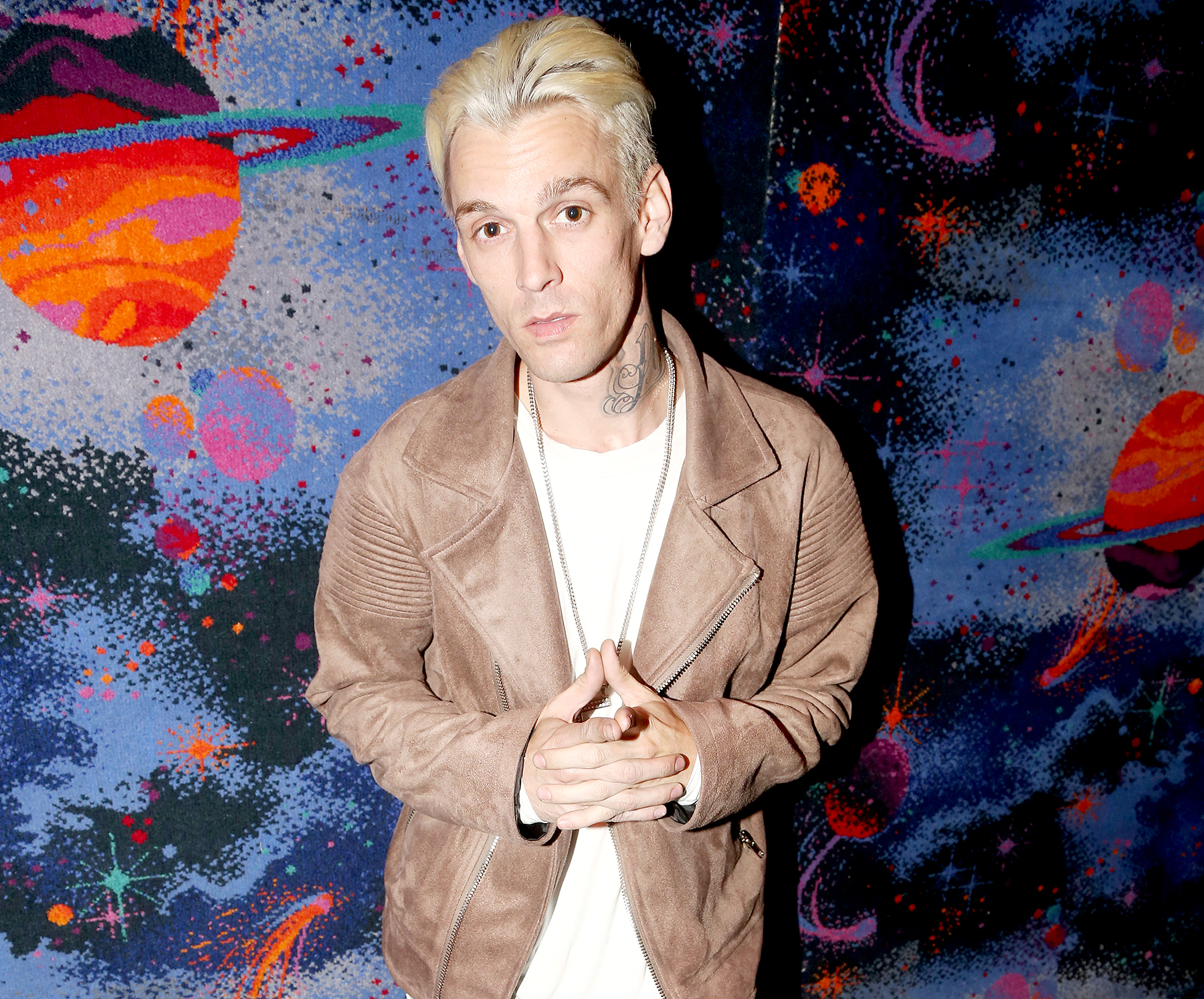 Aaron Carter poses during a handprint ceremony and meet & greet with fans as he visits Planet Hollywood Times Square on April 24, 2017 in New York City.